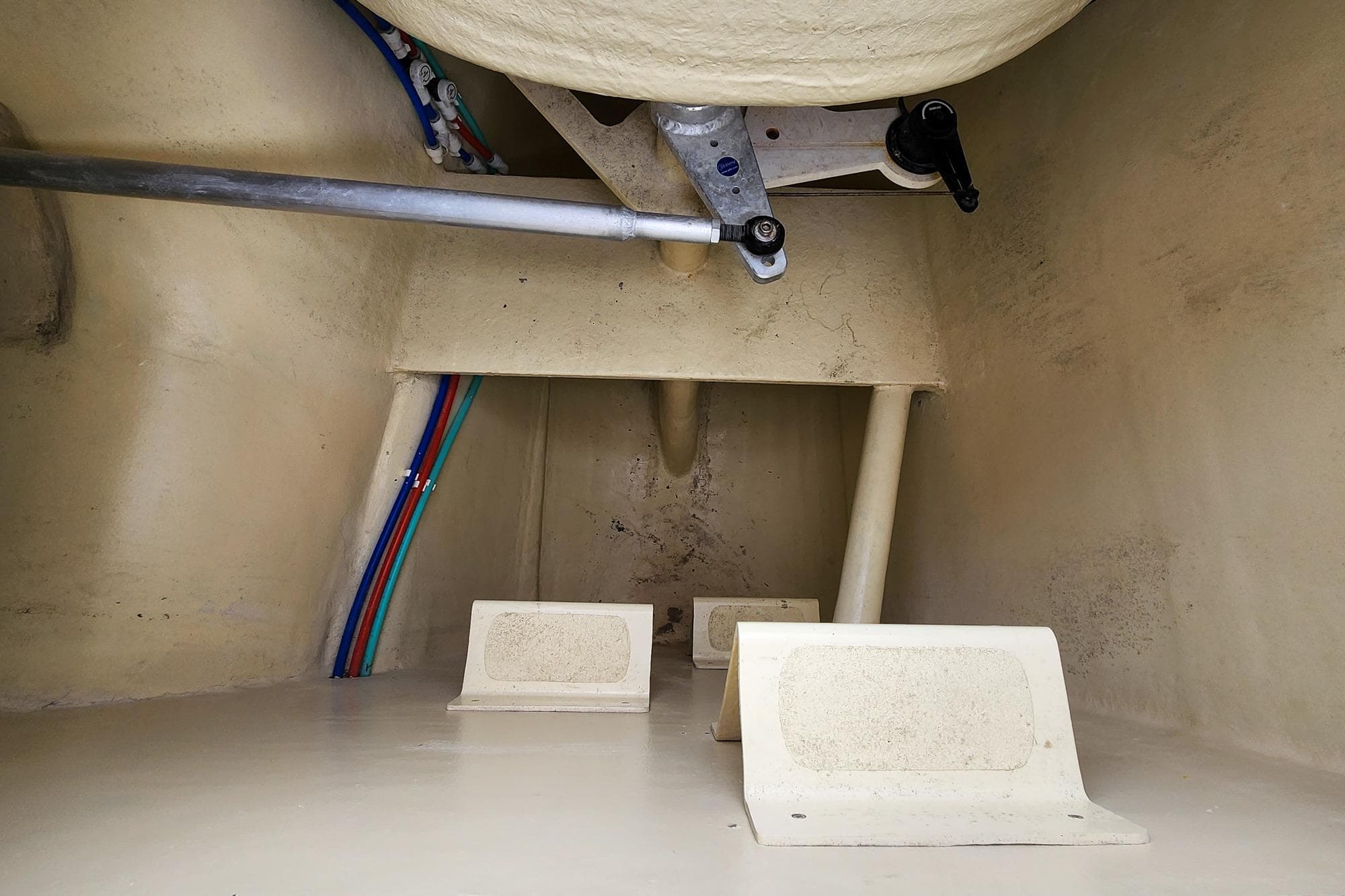 Interior view of 2019 Antares 44GT boat hull with visible piping and structural components.