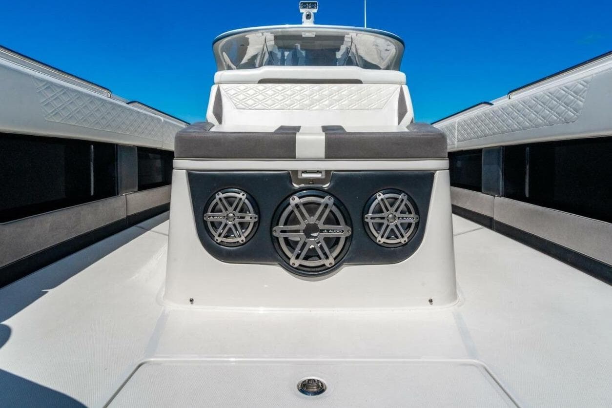 2019 Cigarette 41' GTR boat interior with JL Audio speakers, sleek design, and blue sky backdrop.