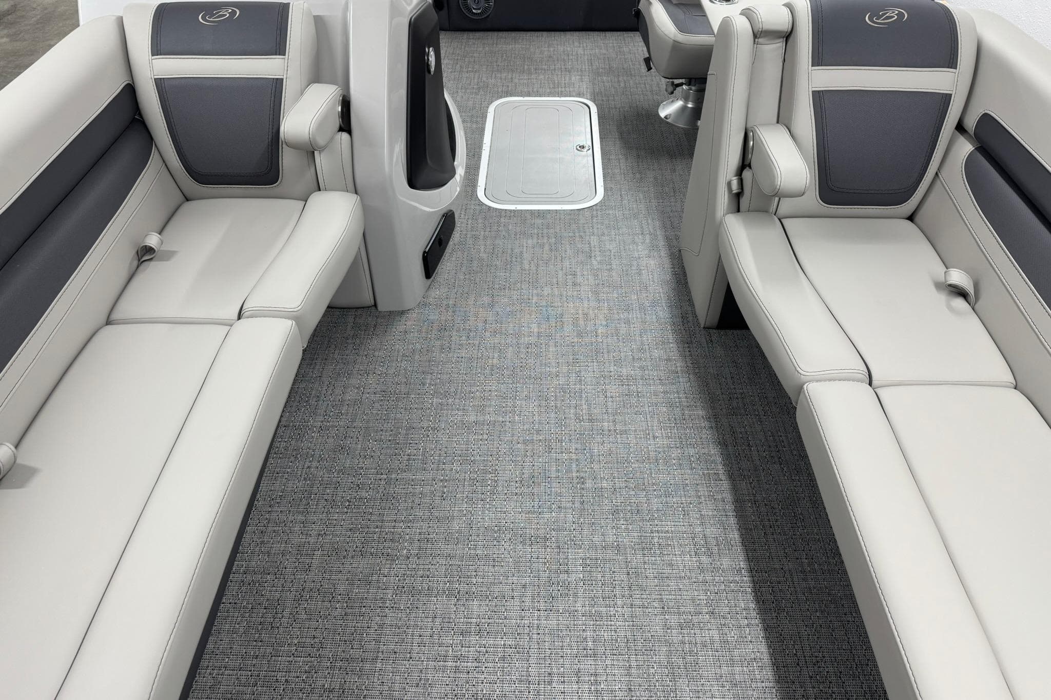 2025 Barletta Cabrio 24UC interior with gray seating and flooring.