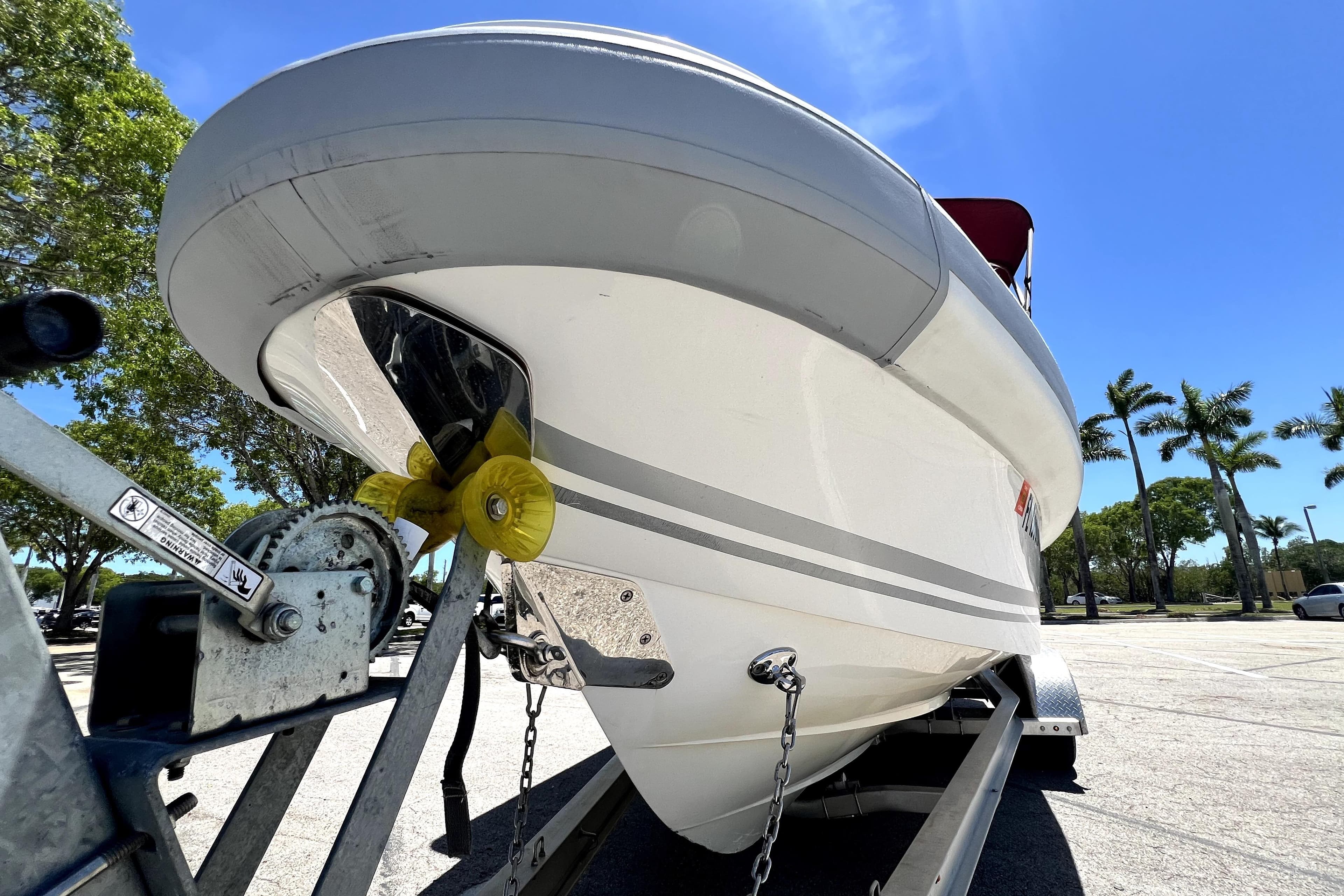 2013 Novurania Chase 23 boat on trailer under clear blue sky.