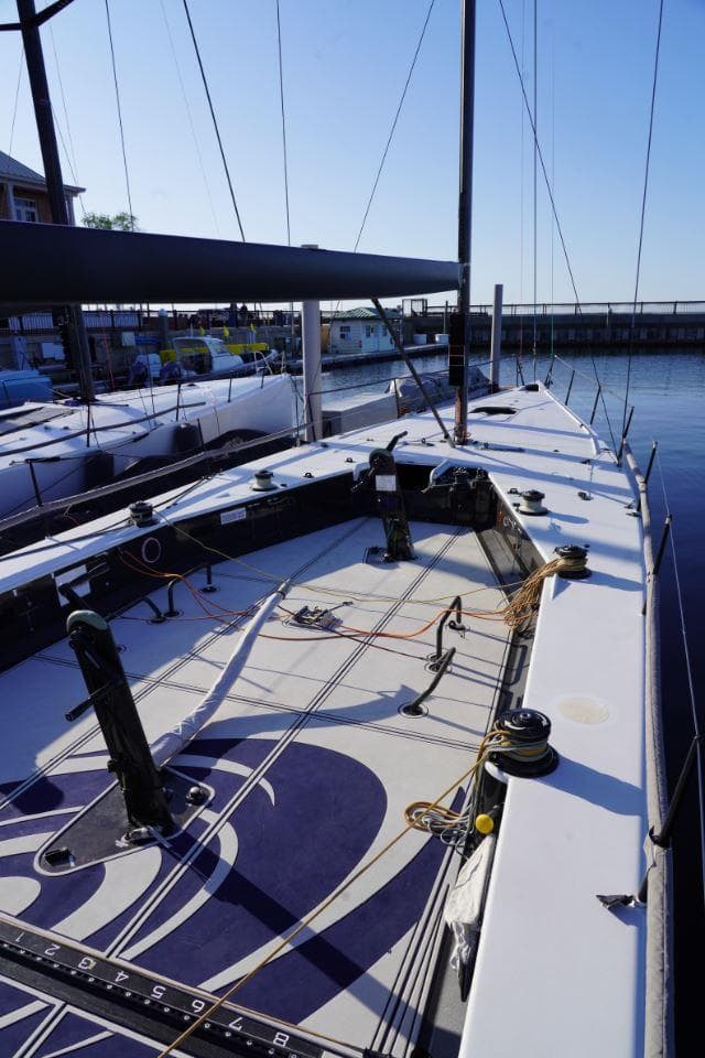 2015 Judel and Vrolijk TP 52 sailboat docked, showcasing sleek deck design and rigging.