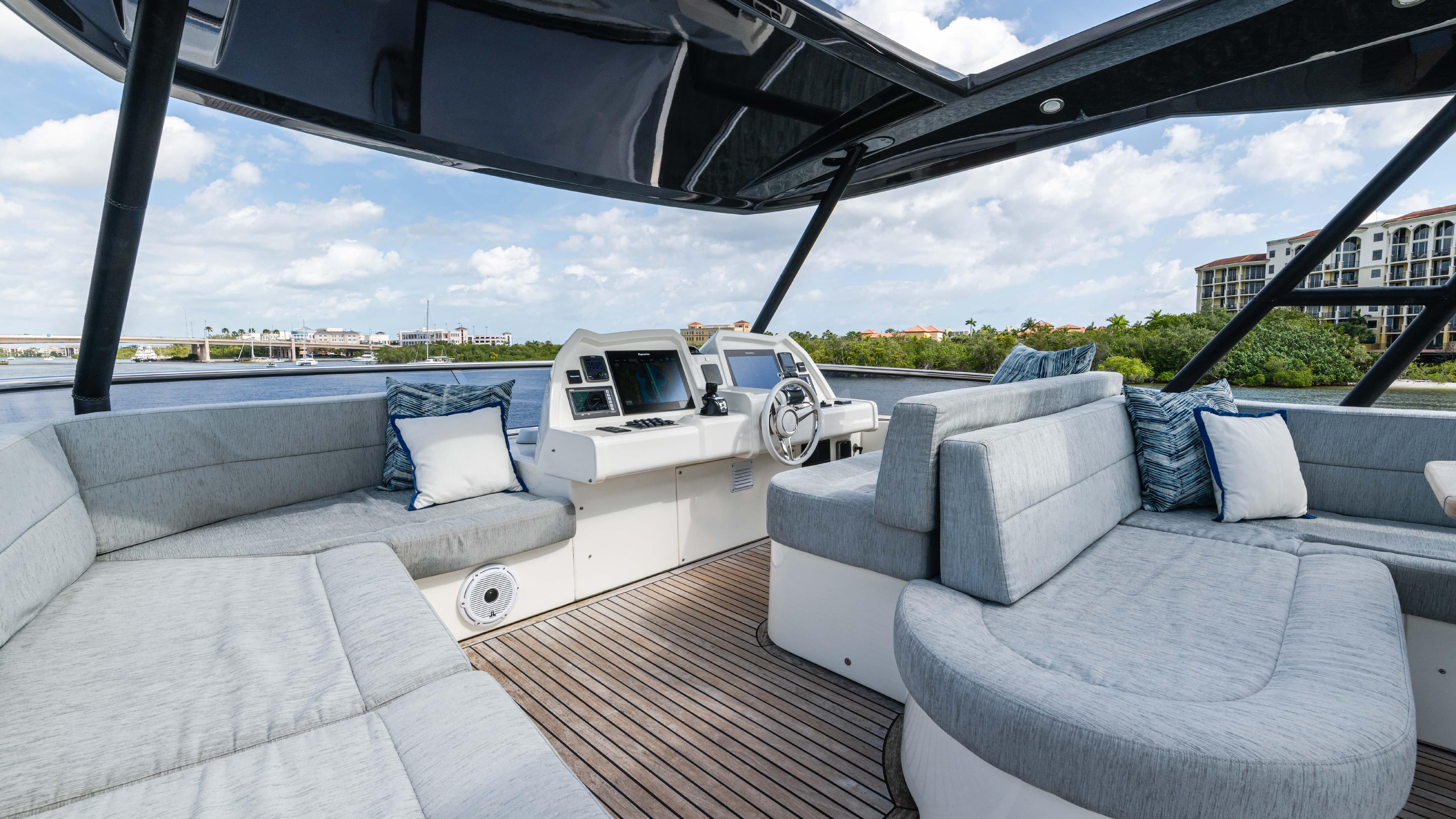 Luxurious 2016 Monte Carlo Yachts MCY 65 interior with plush seating and modern helm.