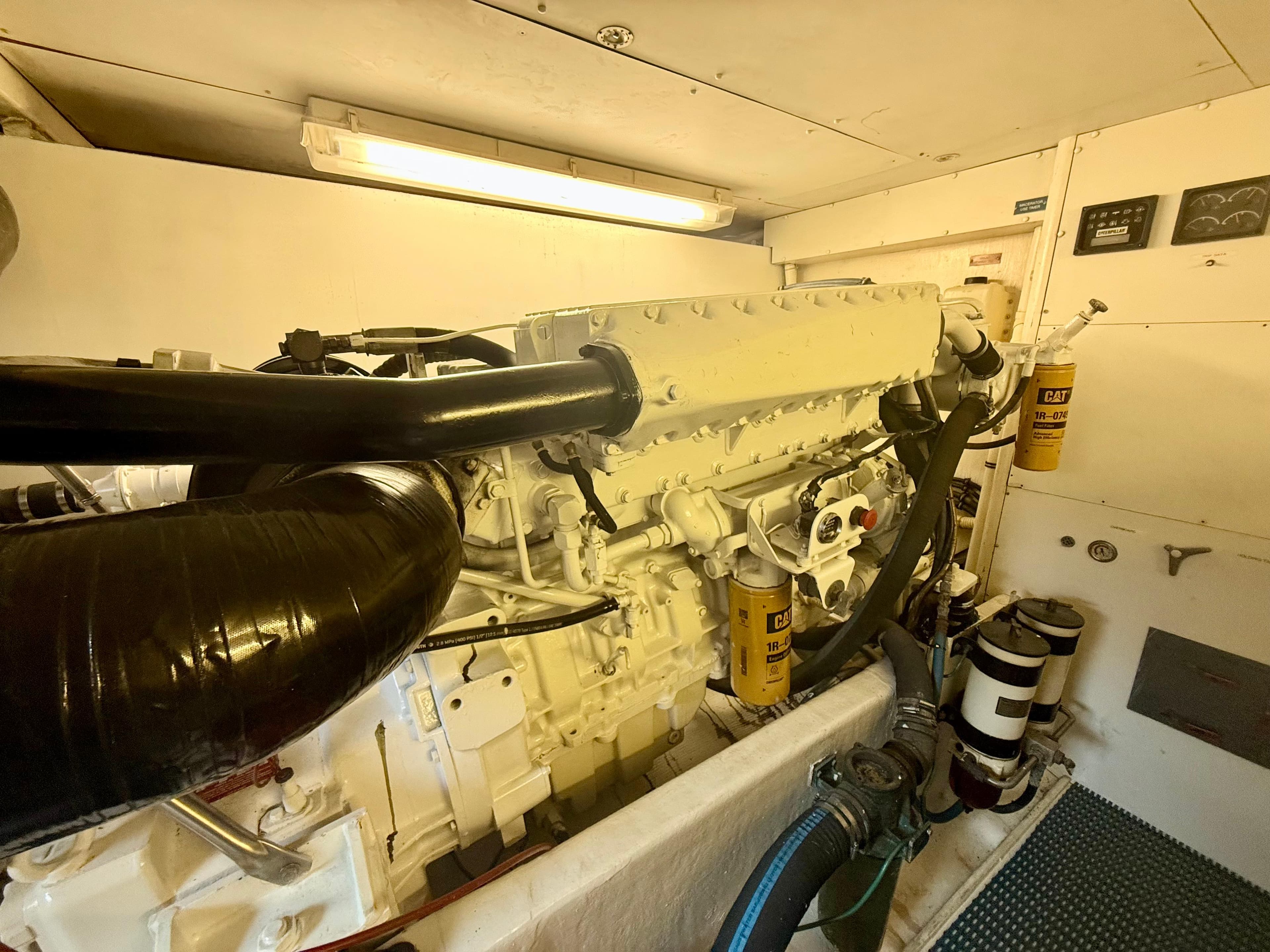 Engine room of 1997 West Bay Sonship 58 Pilothouse with visible machinery and components.
