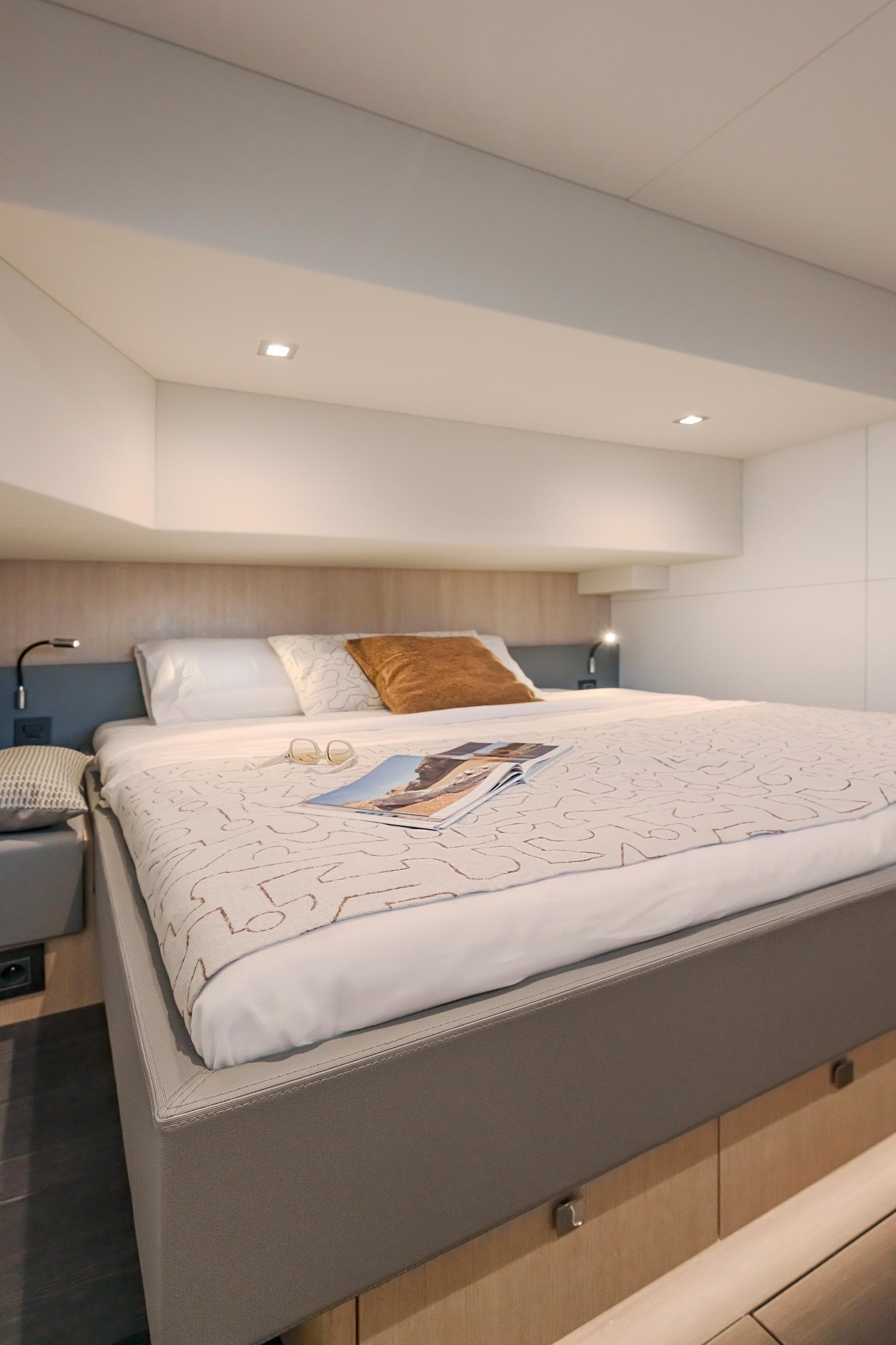 Luxurious bedroom in 2025 Privilege Signature 650 yacht with modern design.