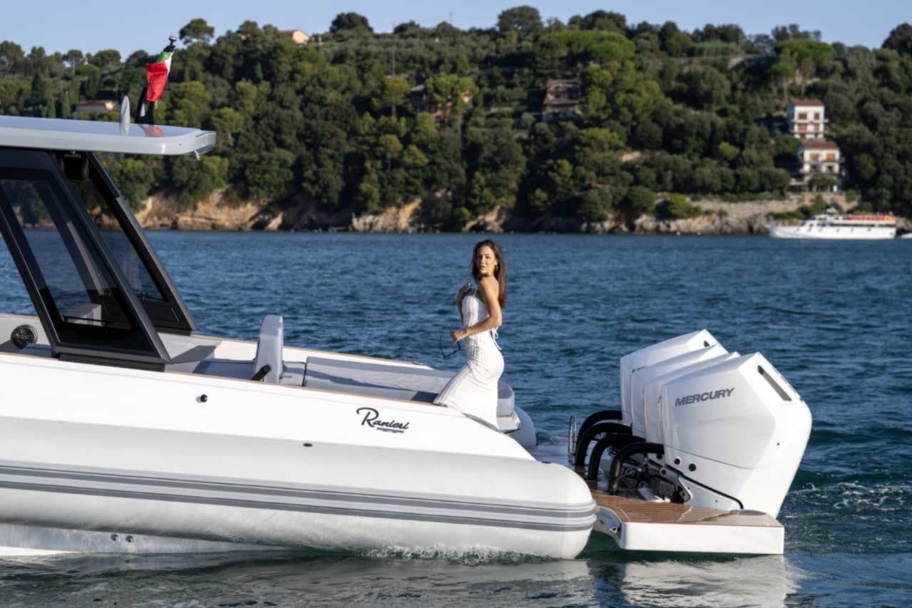 2026 Ranieri CAYMAN 50 HARDTOP yacht with Mercury engines on scenic water.