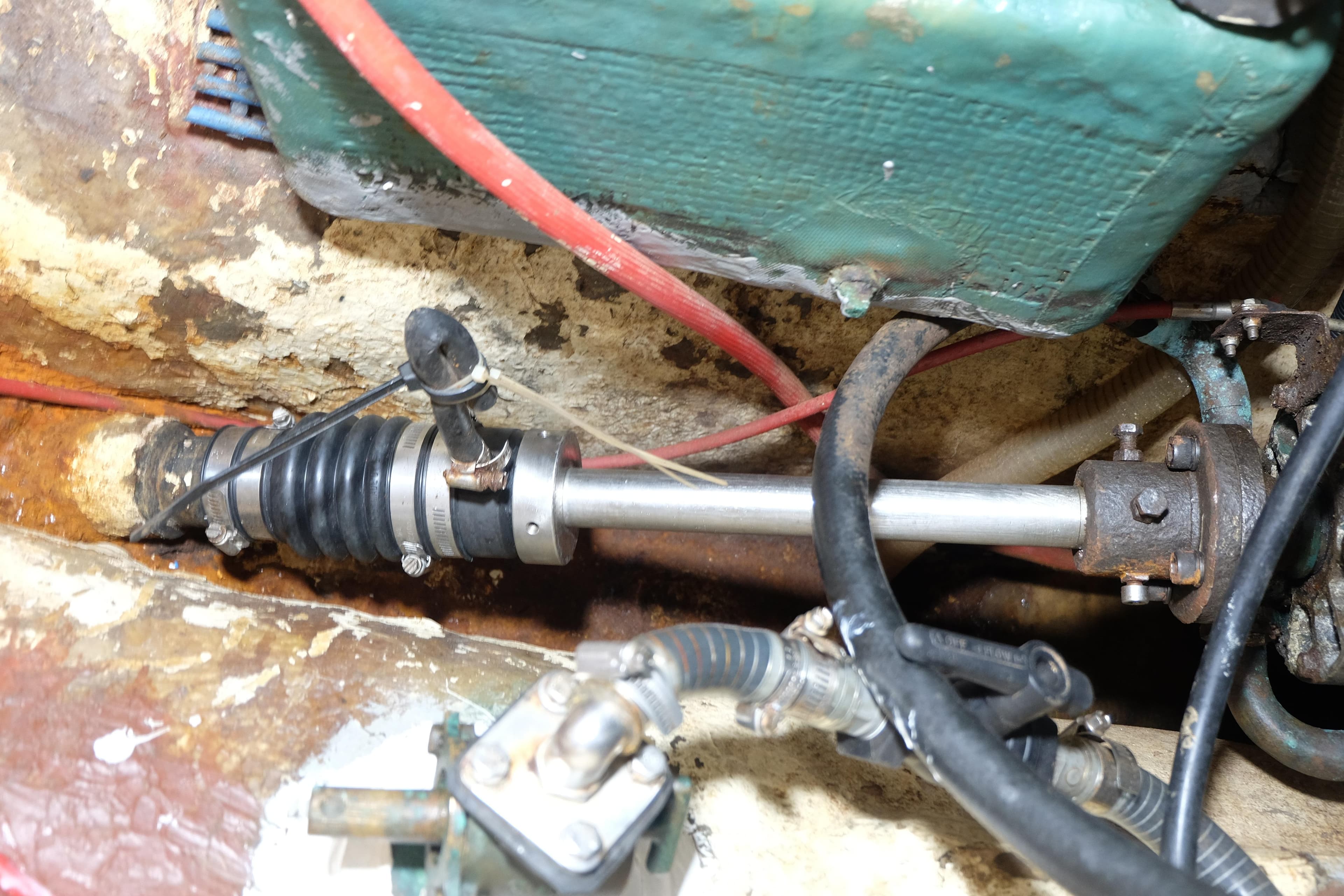 Mechanical components of a 1979 Westwind 35 boat, featuring a propeller shaft and surrounding machinery.