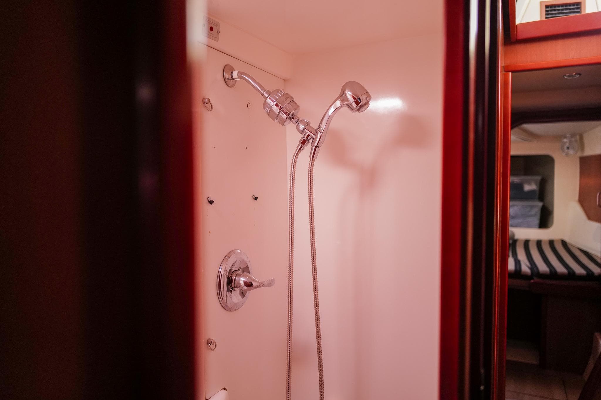 Shower area inside a 2012 Leopard 44 yacht, featuring modern fixtures and cozy cabin view.