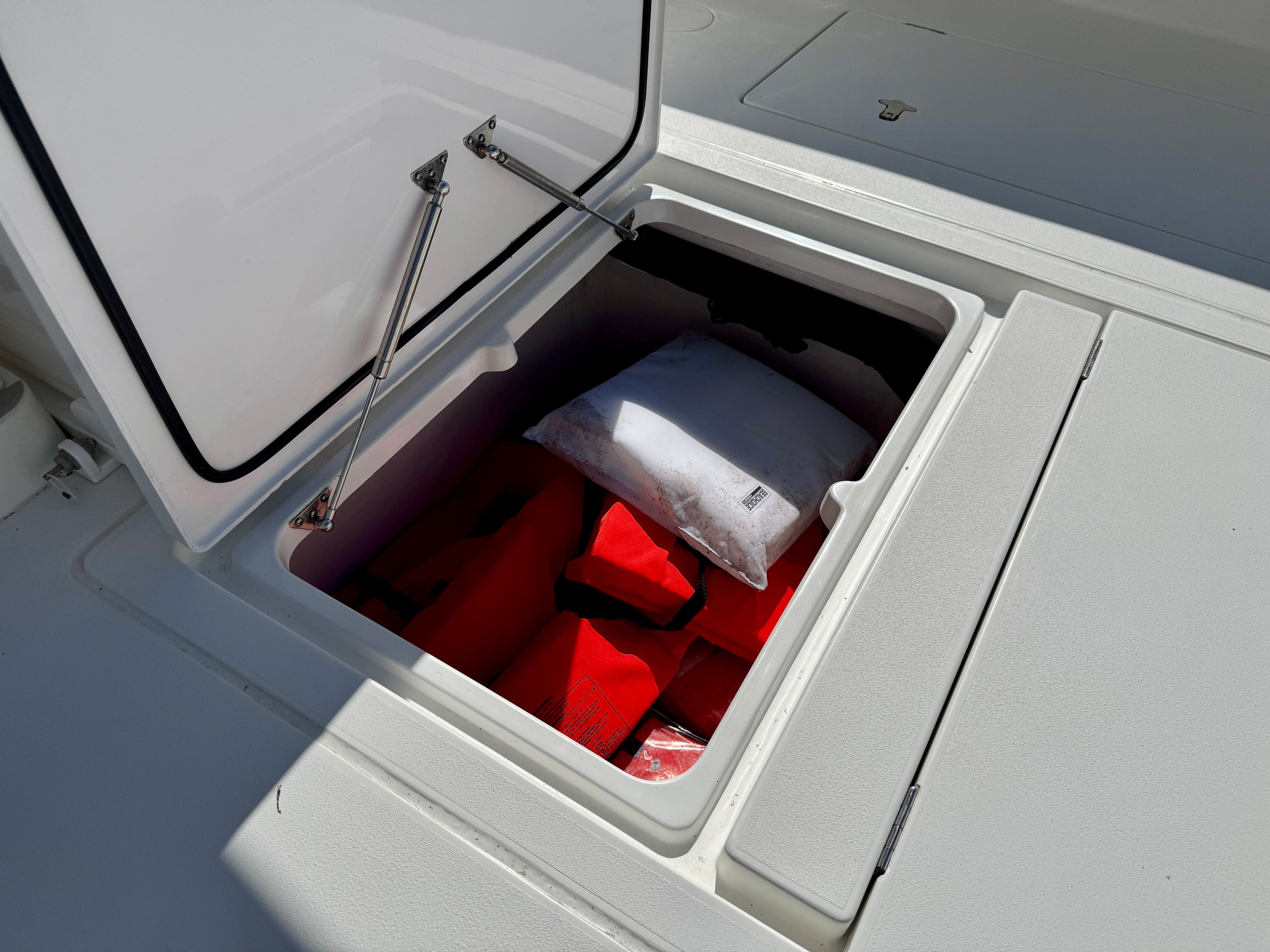 Storage compartment in 2024 Intrepid 407 Nomad FE with safety gear.