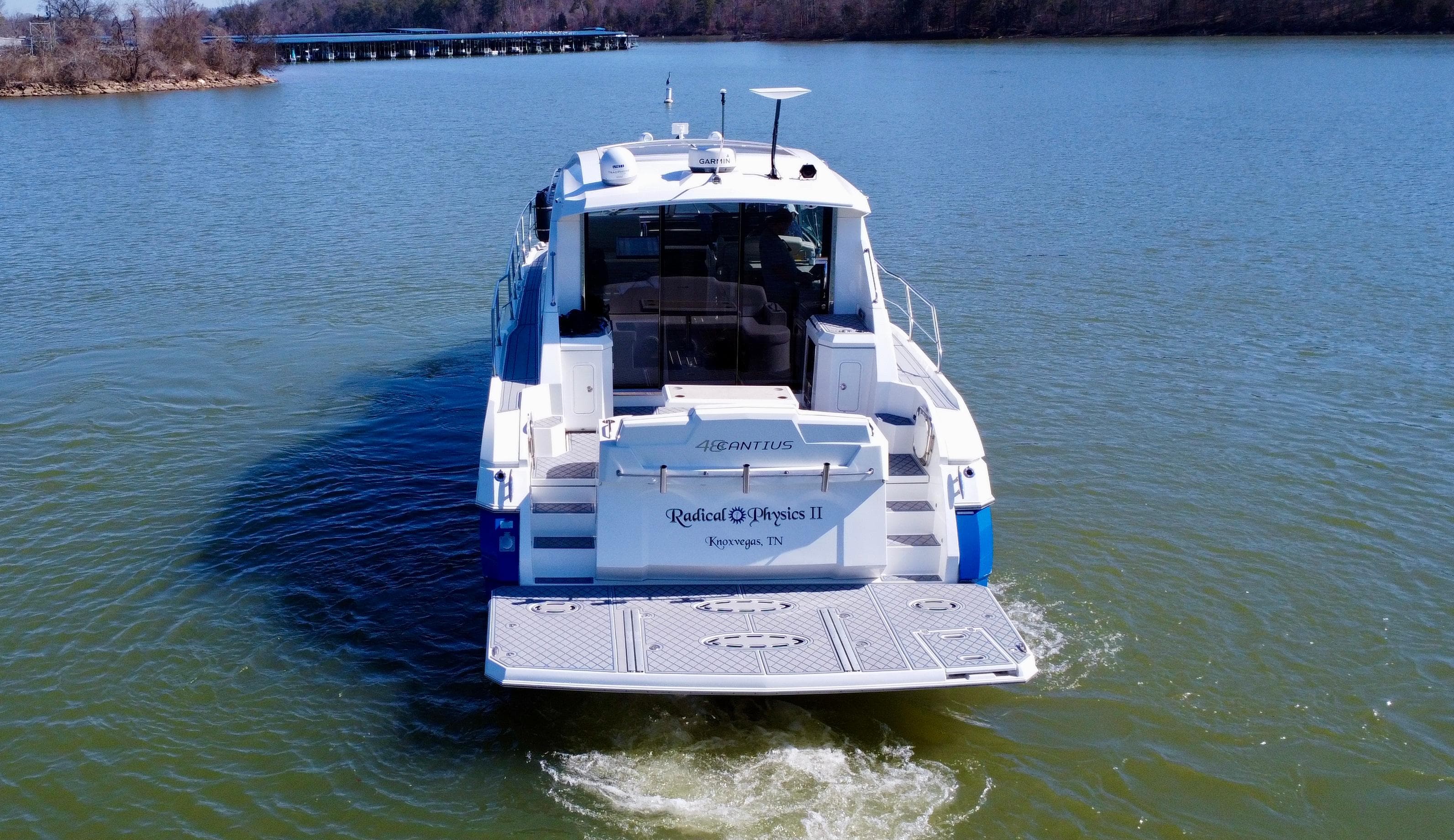 2012 Cruisers Yachts 48 Cantius on calm water, rear view.