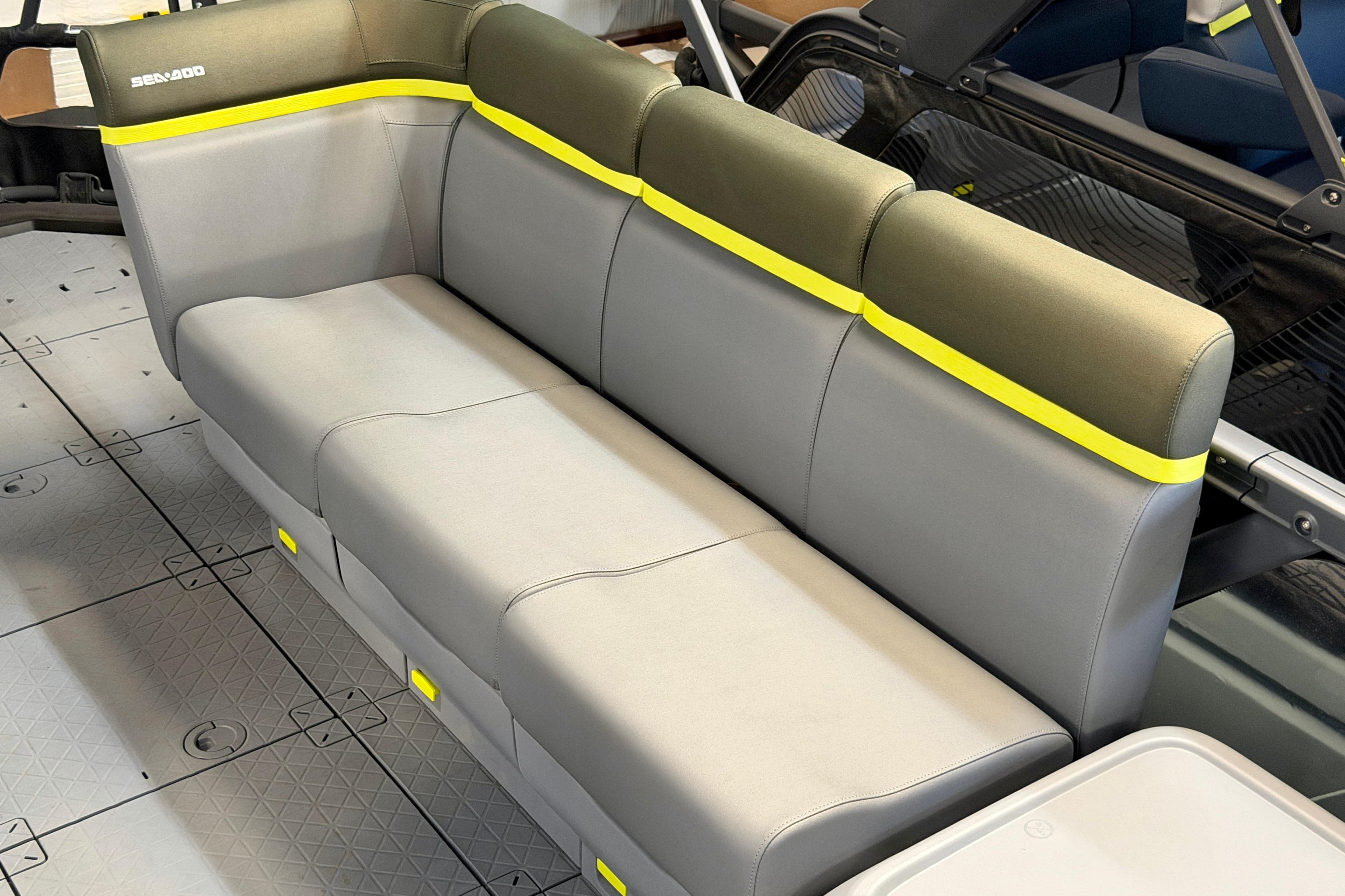 2026 Sea-Doo Switch Fish 21 interior seating with gray and yellow accents.