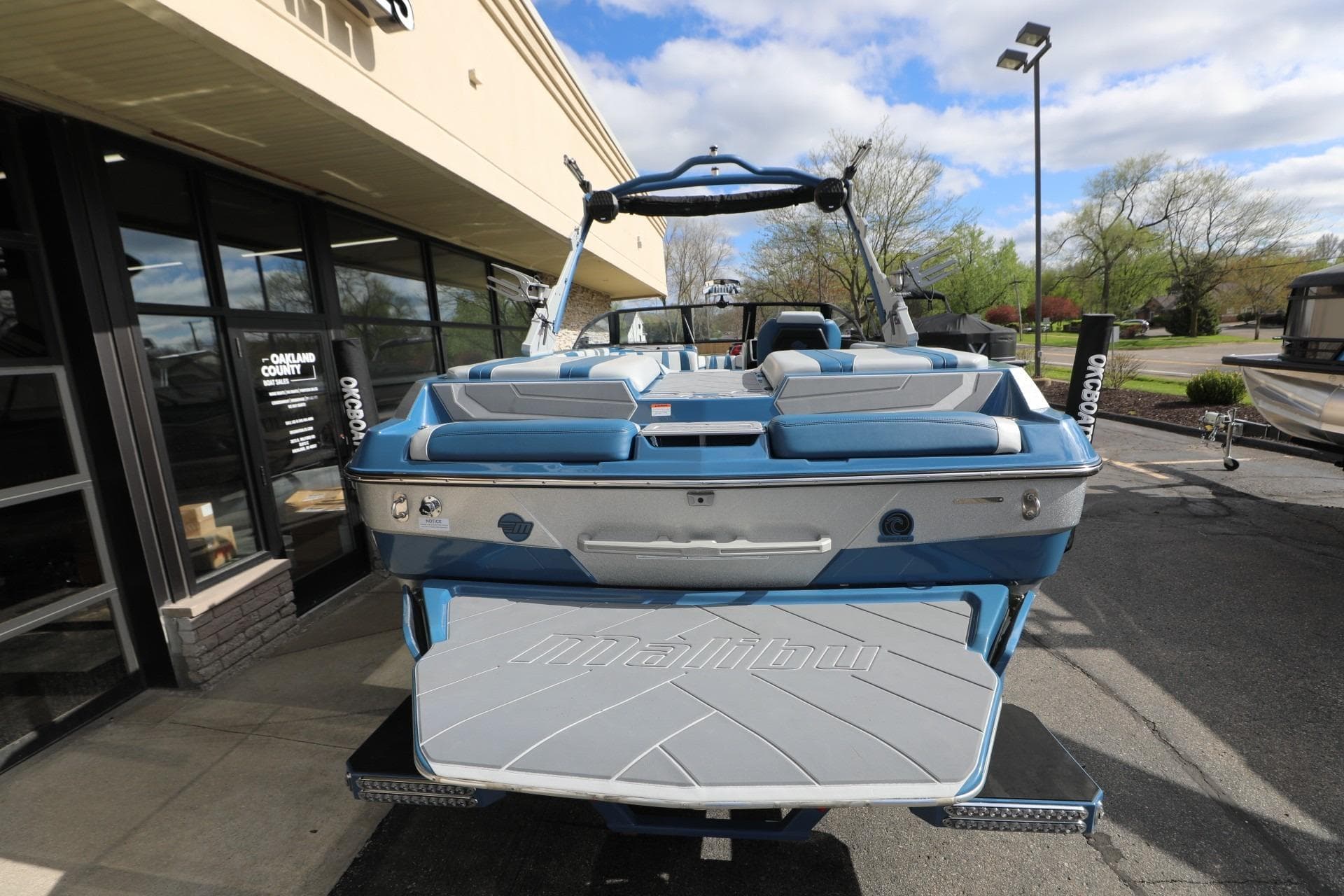 2023 Malibu Wakesetter 22 LSV boat displayed outdoors, showcasing sleek design and seating.