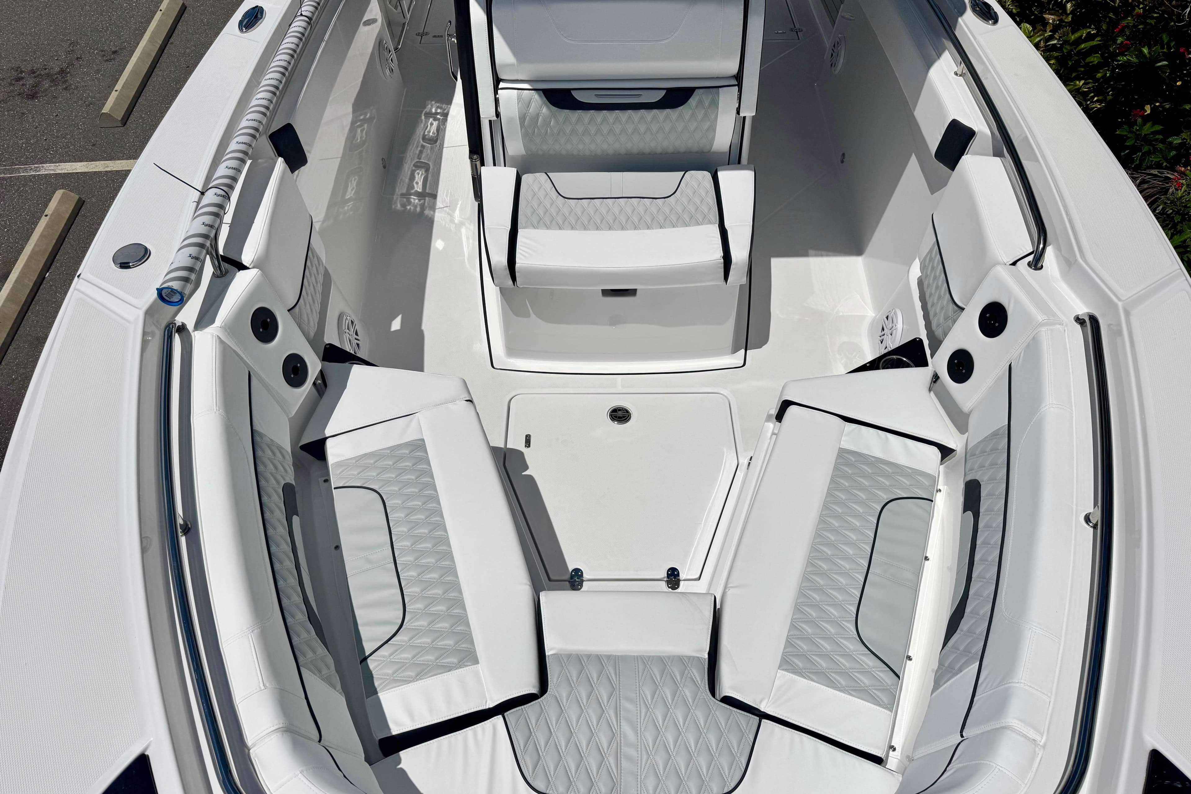 2026 Blackfin 272 CC boat interior with white cushioned seating and modern design.