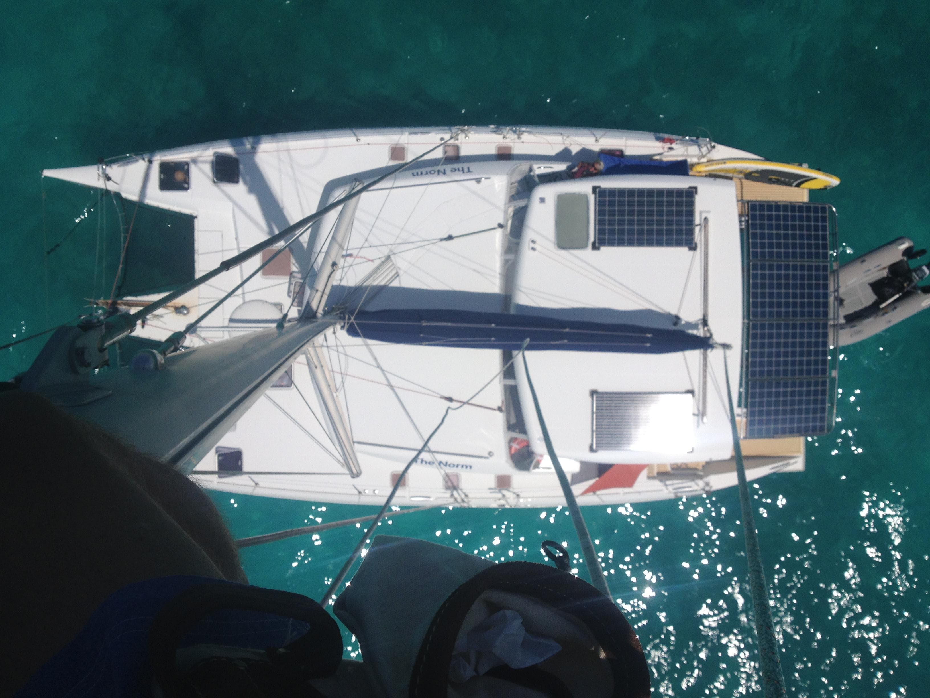 Aerial view of a 2007 Lagoon 420 yacht with solar panels.