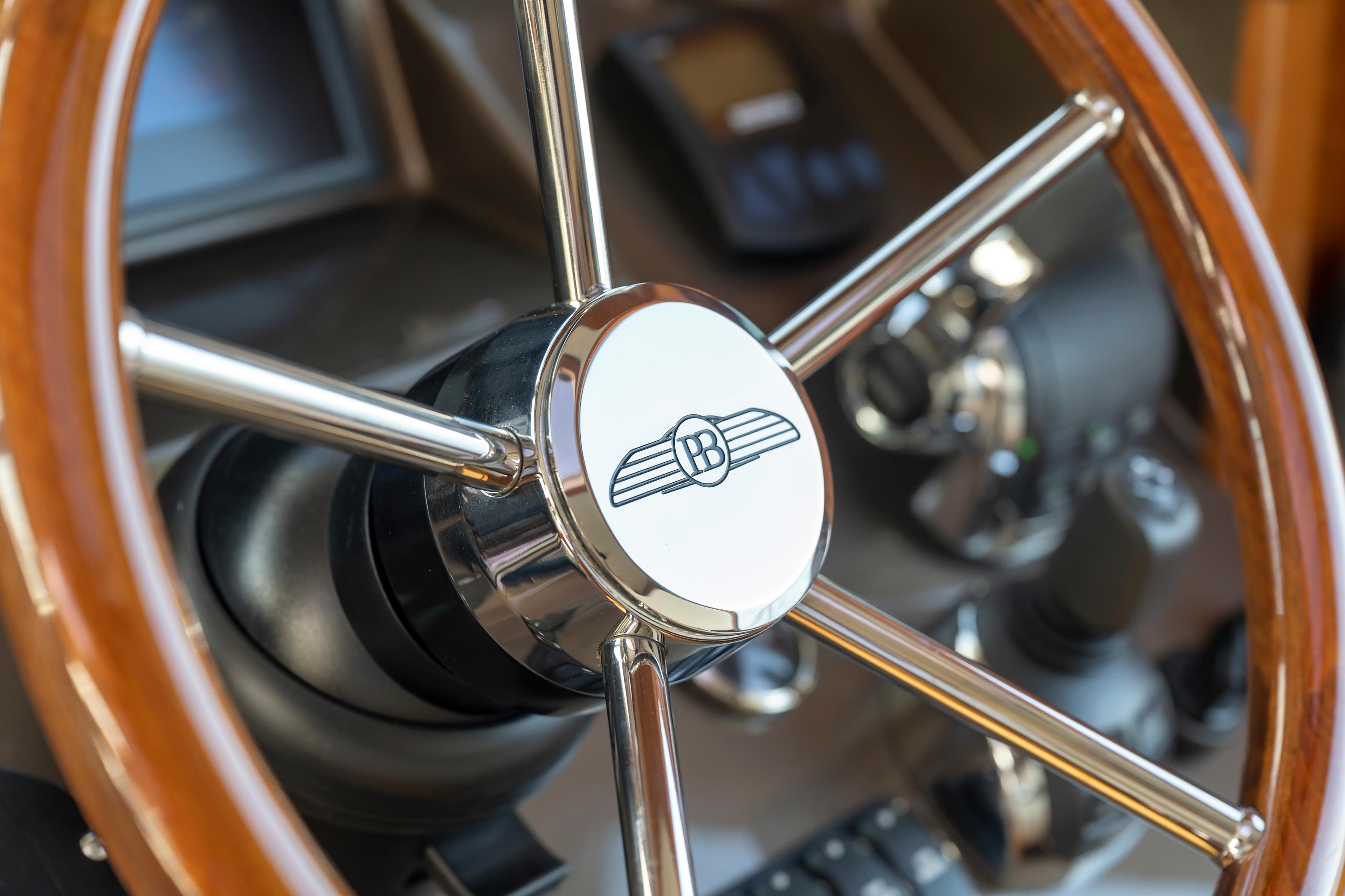 Steering wheel of 2026 Palm Beach Motor Yachts PB45, showcasing luxury design details.