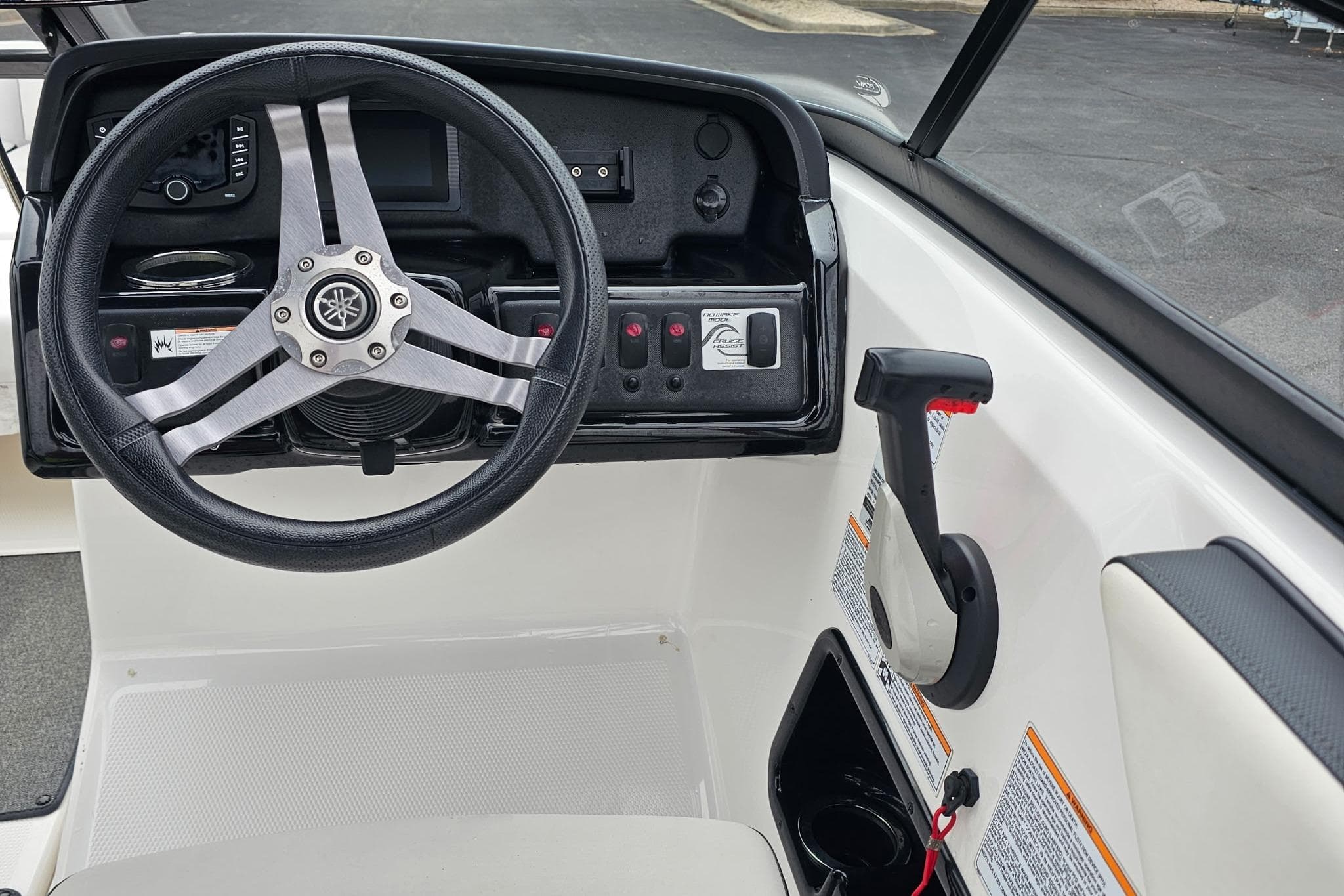 2019 Yamaha Boats AR195 steering wheel and control panel, featuring sleek design and functionality.