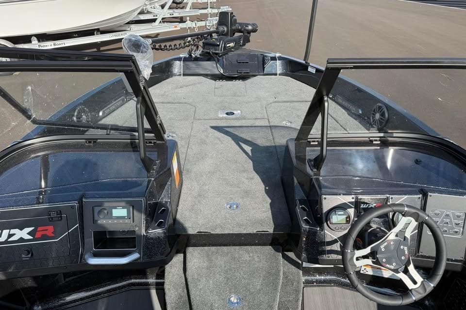 2026 Skeeter WXR2060 F boat interior with steering wheel and dashboard controls.