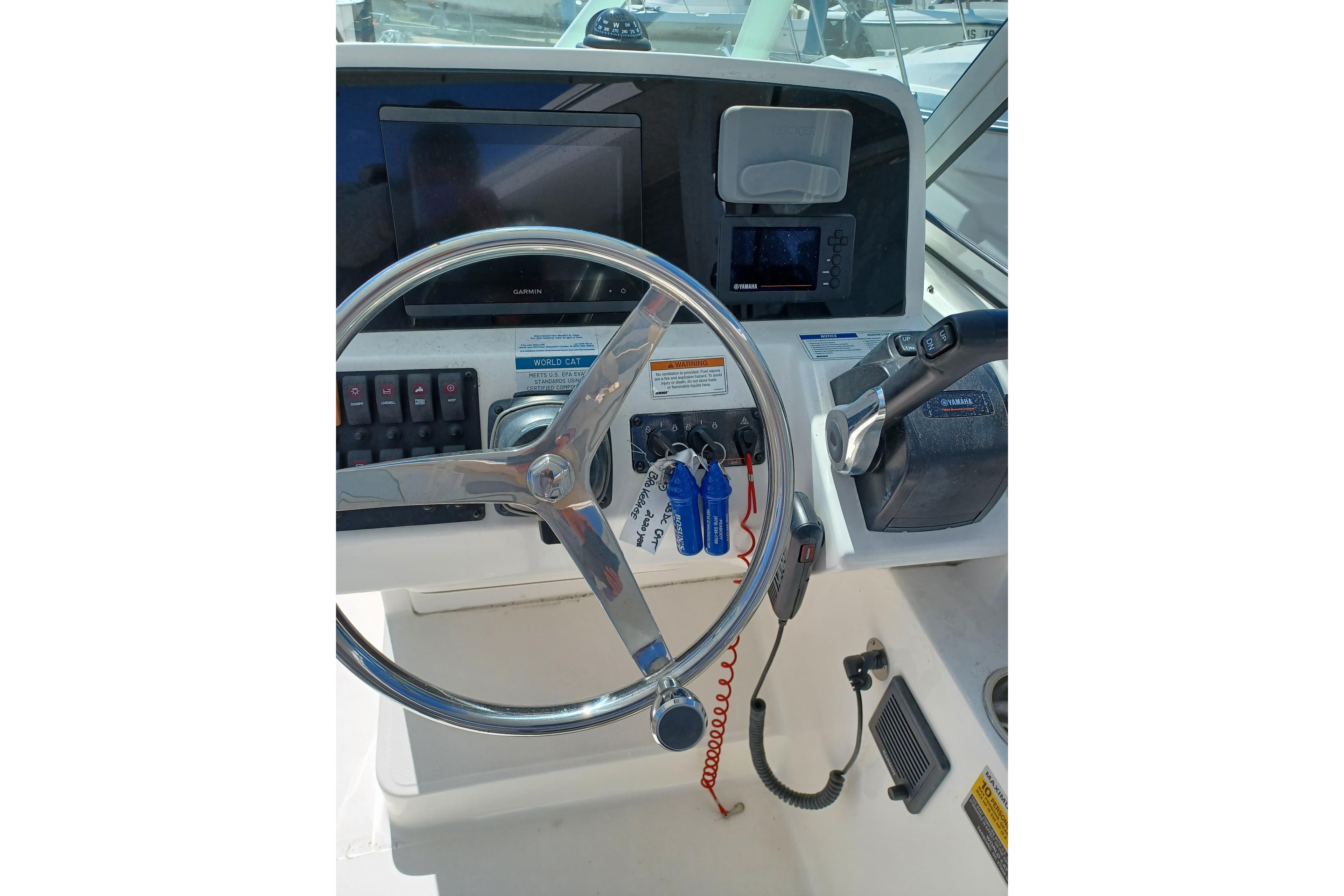 Steering console of 2020 World Cat 230 DC boat with navigation equipment.