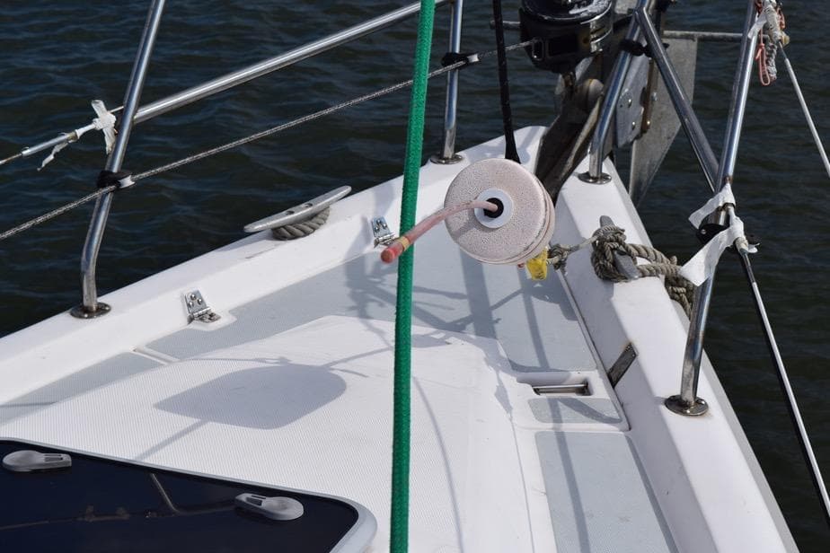 Deck of 2001 Hunter 340 sailboat with ropes and fittings in view.