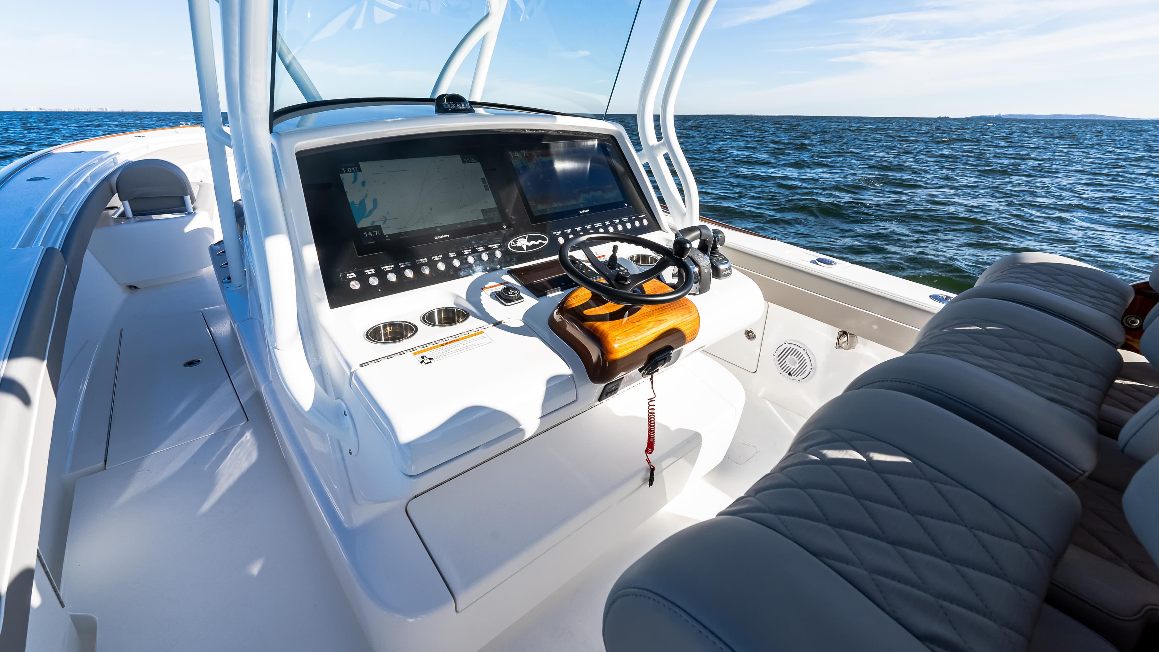 2025 Valhalla Boatworks V-37 helm with modern controls on open water.