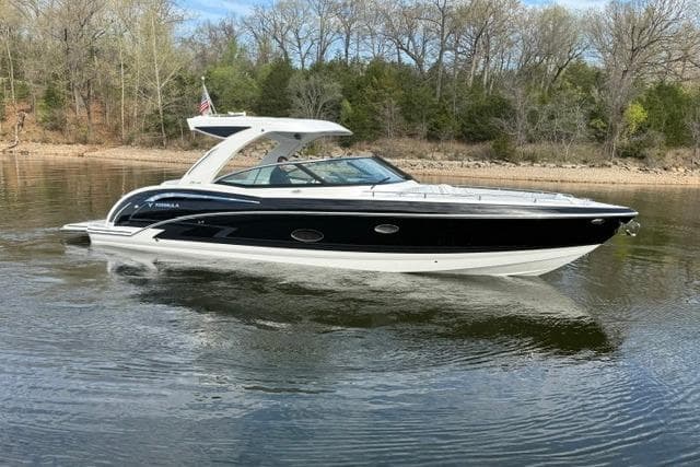 2025 Formula 350 Crossover Bowrider I/O cruising on a calm lake.