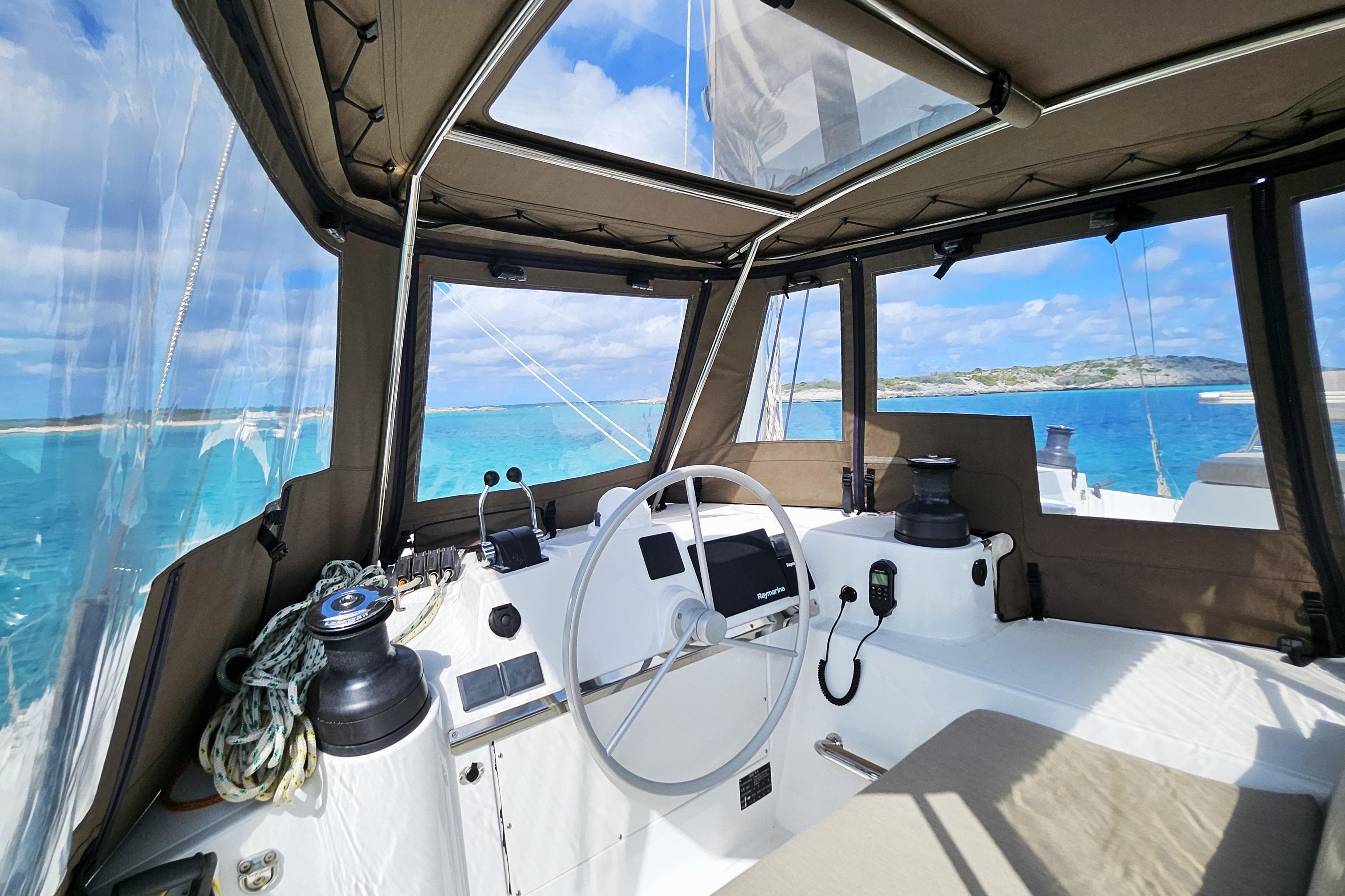 Cockpit view of 2022 Bali 4.4 Owners Version yacht with turquoise sea and clear skies.
