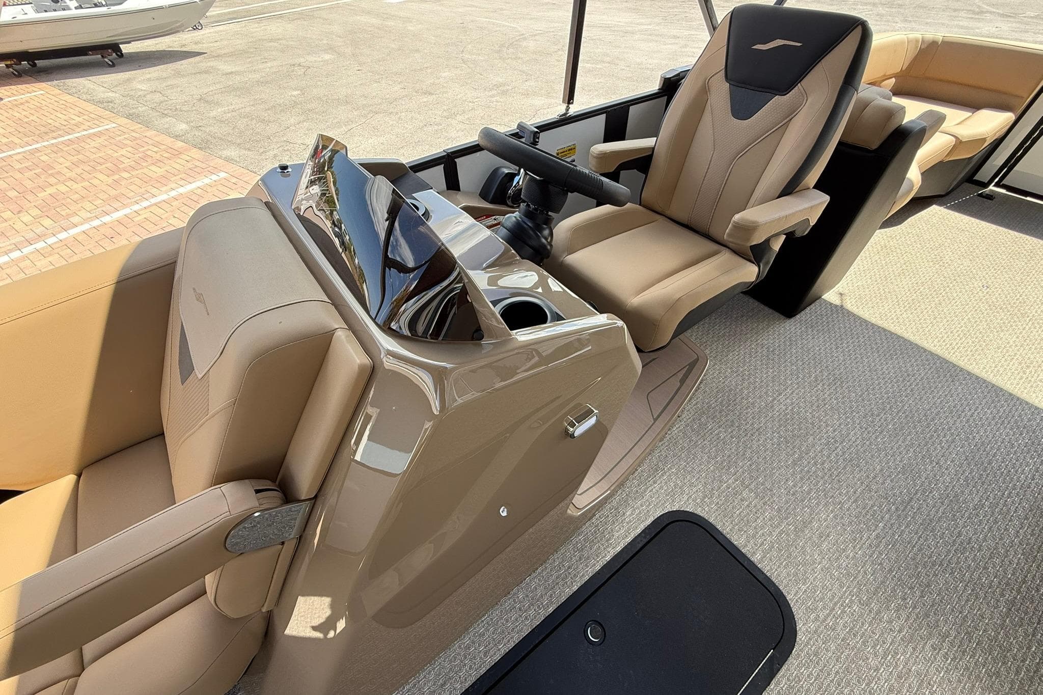 Luxurious interior of 2026 Evotti 523QL boat with plush seating and modern controls.