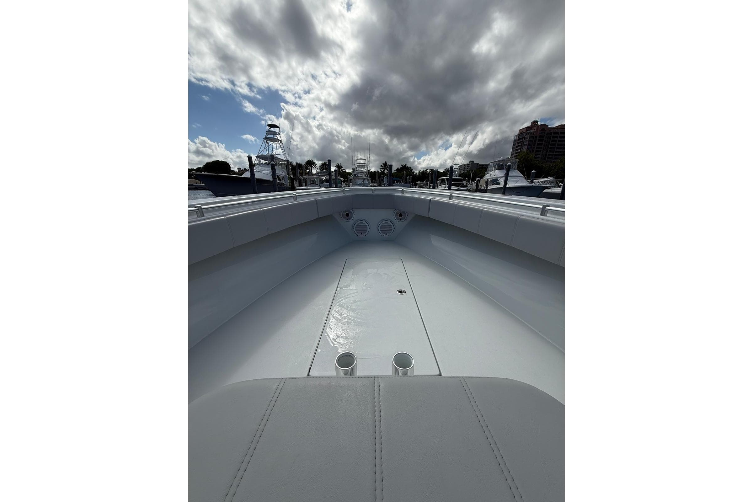 2024 Contender 39 ST boat interior with cloudy sky and marina view.
