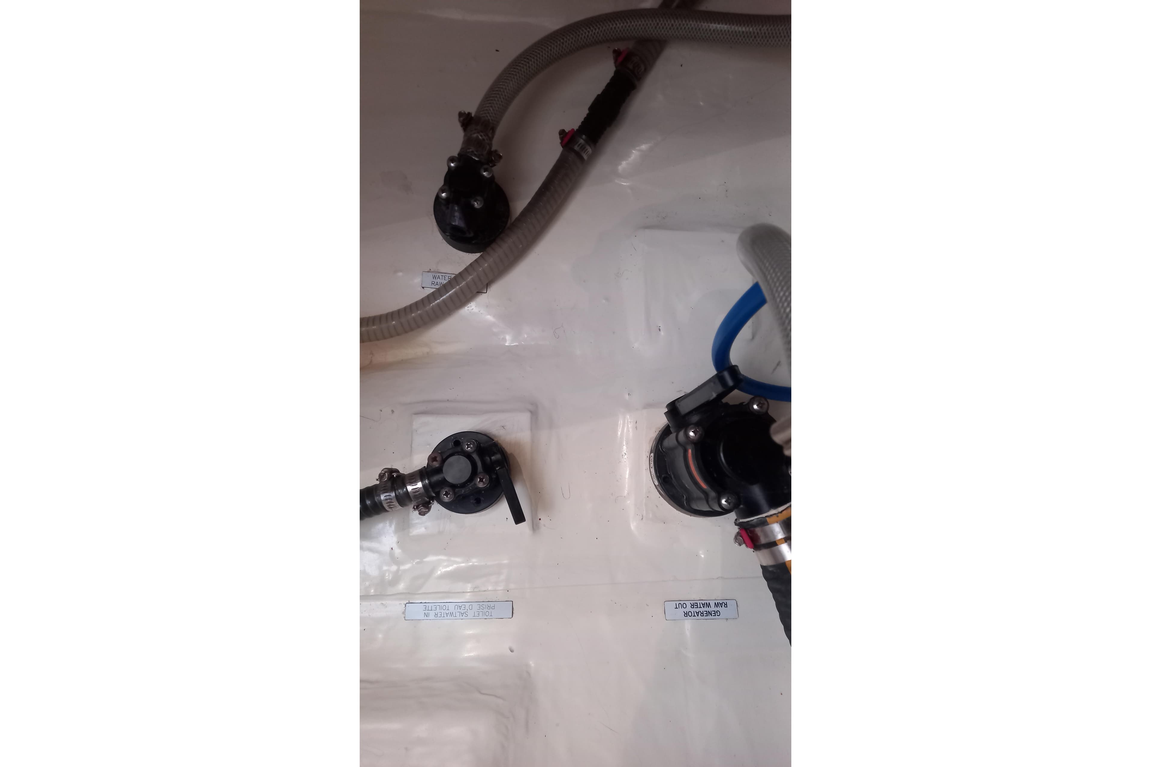 Boat plumbing system in a 2019 Leopard 45 model, featuring hoses and valves.