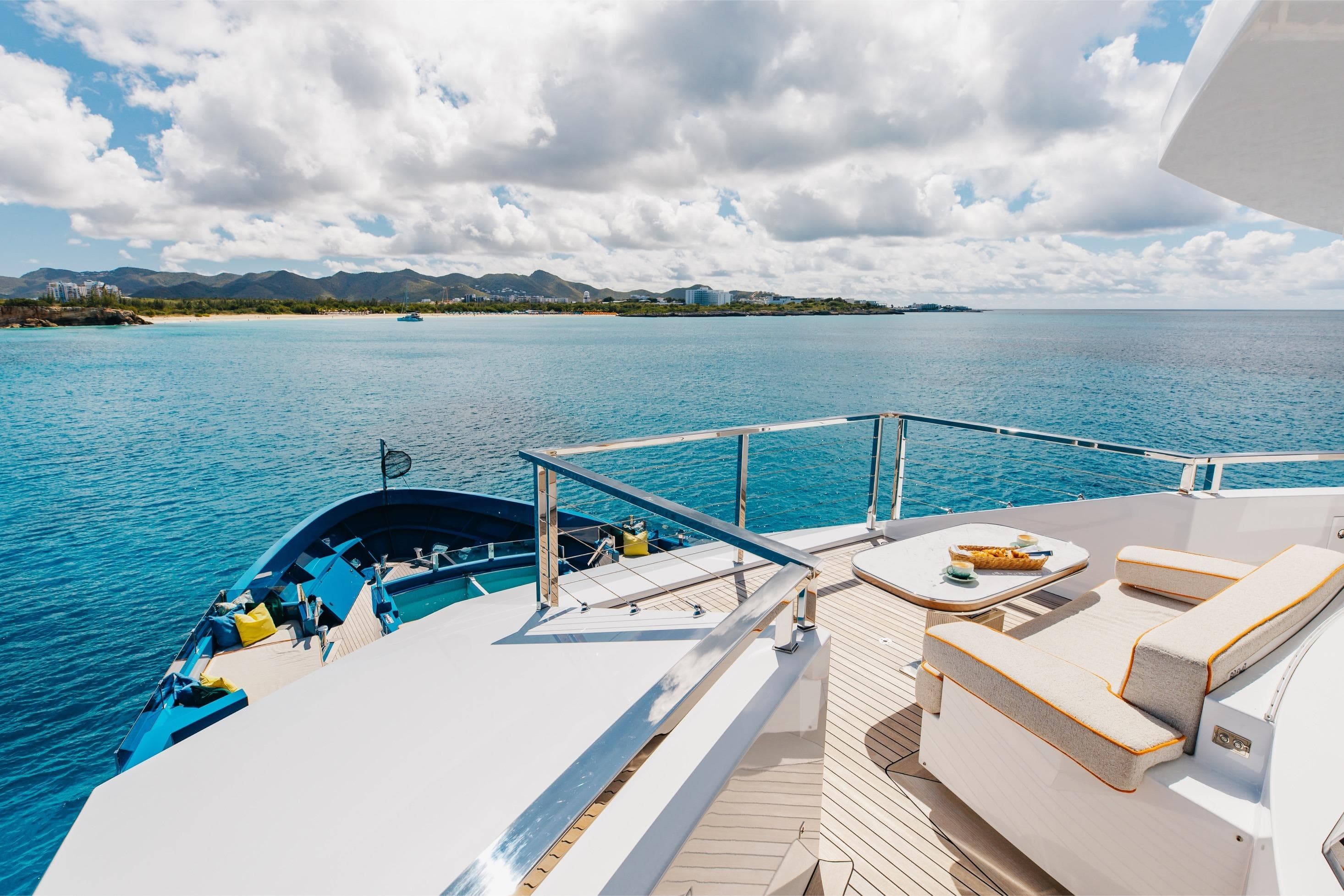 Luxurious 2024 Dunya Yachts Explorer with scenic ocean view and elegant deck seating.