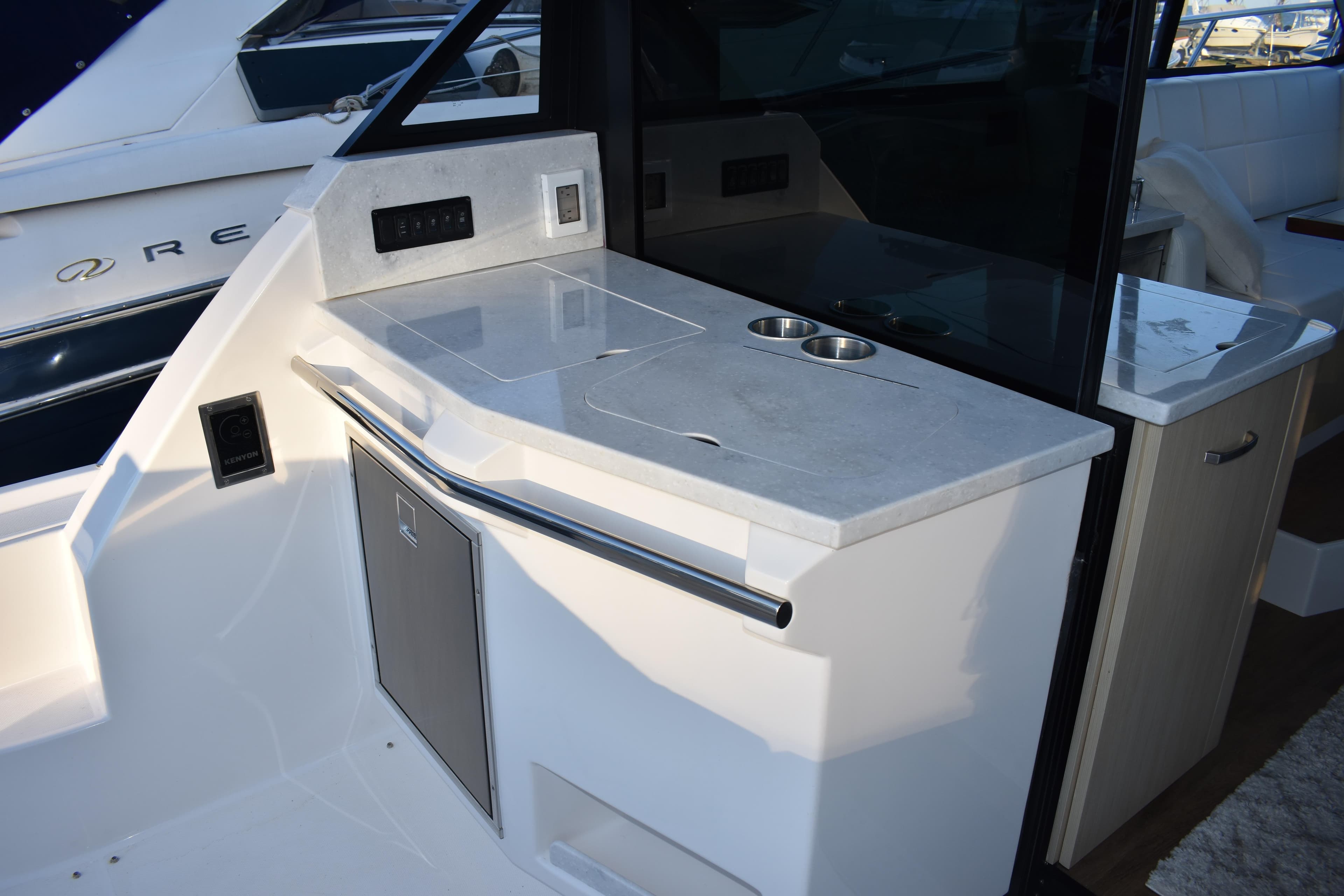 2025 Regal 38 FXO yacht interior with sleek countertop and modern amenities.