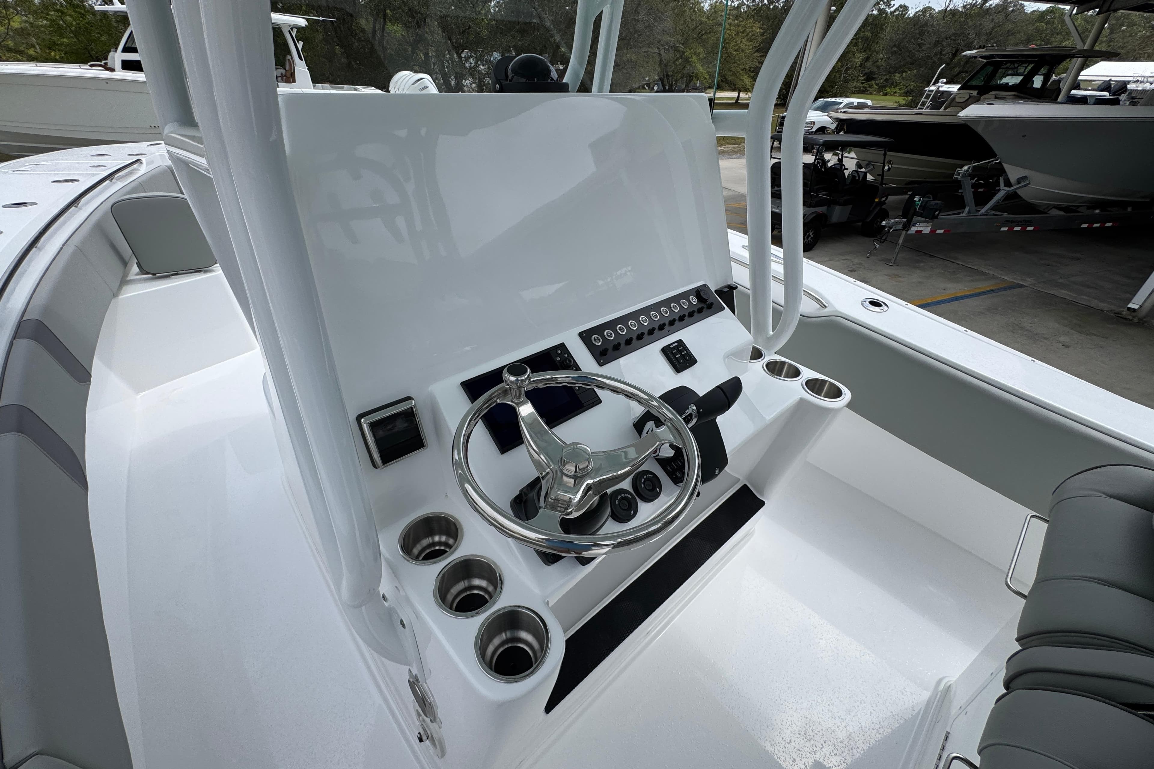 2026 Cape Horn 34 XS boat helm with steering wheel and control panel.
