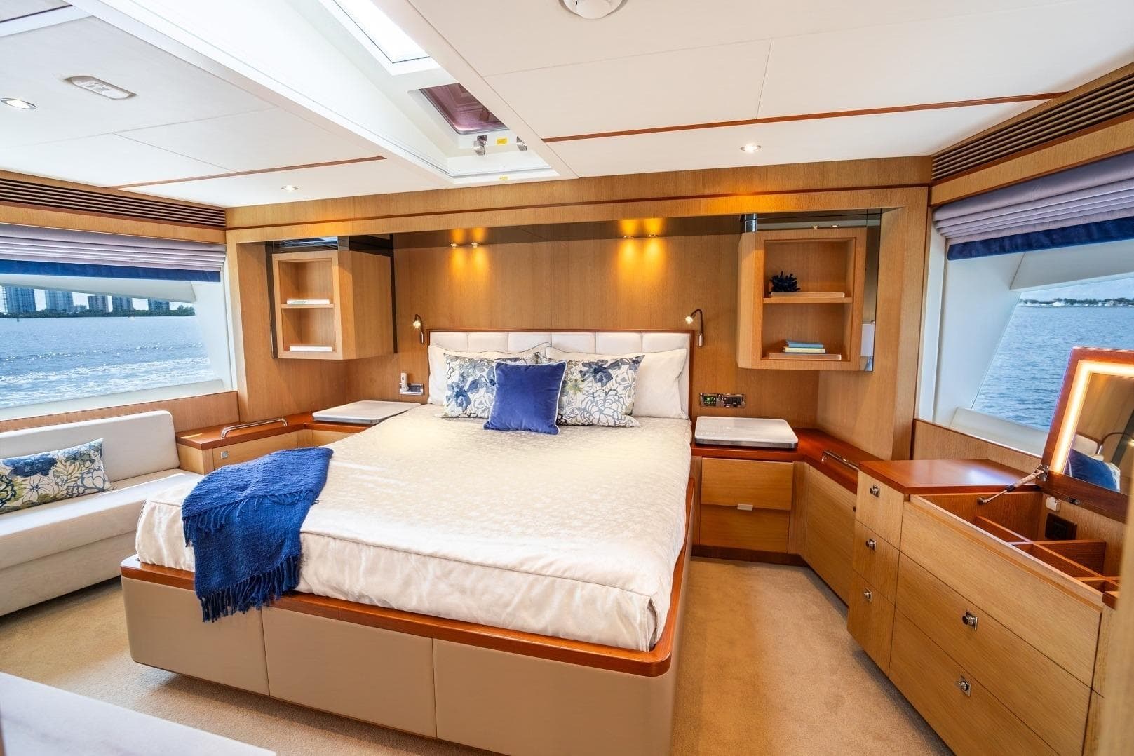 Luxurious bedroom interior on 2020 Horizon FD80 yacht with ocean view.