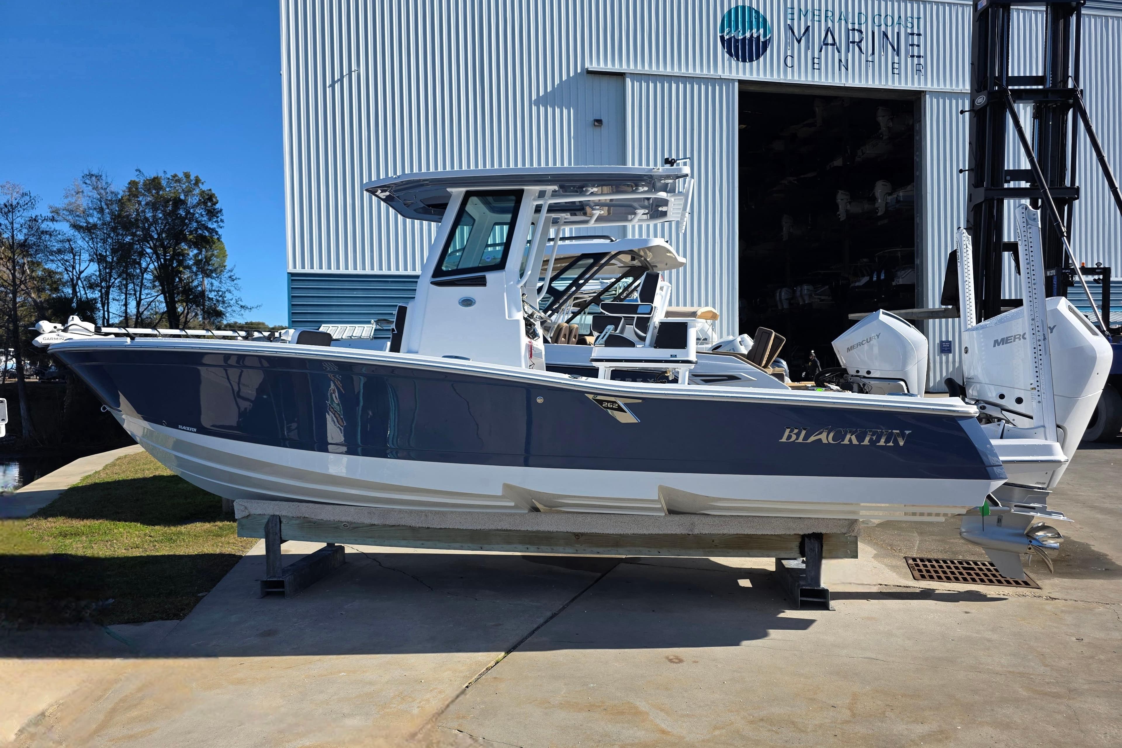 2026 Blackfin 262 HB boat displayed at a marine center.