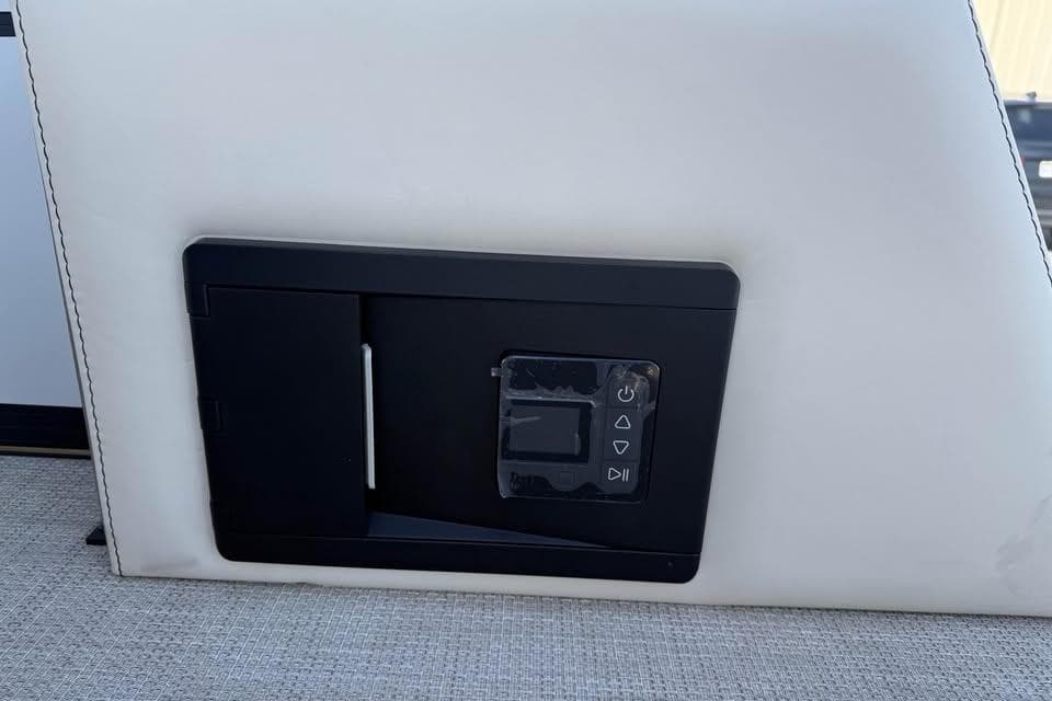 Control panel on Alera M 25Q, 2026 model, featuring sleek black design.