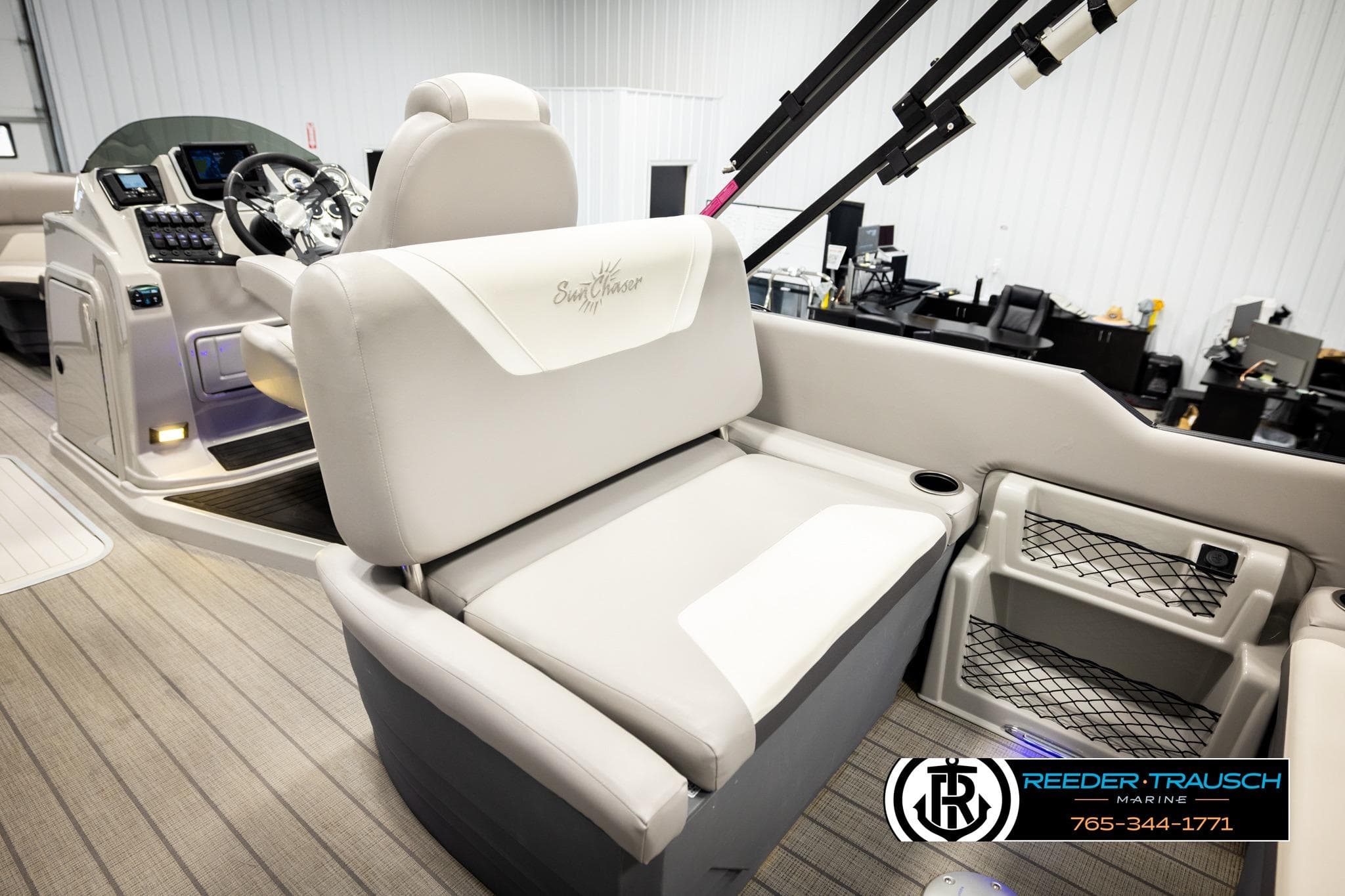 2023 SunChaser 23 Eclipse SSB boat interior with plush seating and modern dashboard.