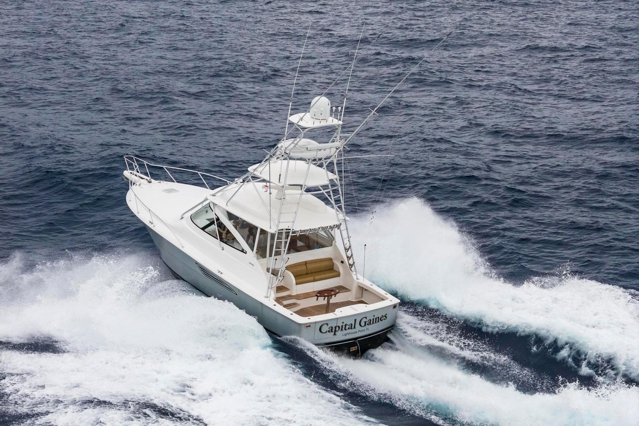 2018 Viking 44 Express yacht navigating ocean waves.