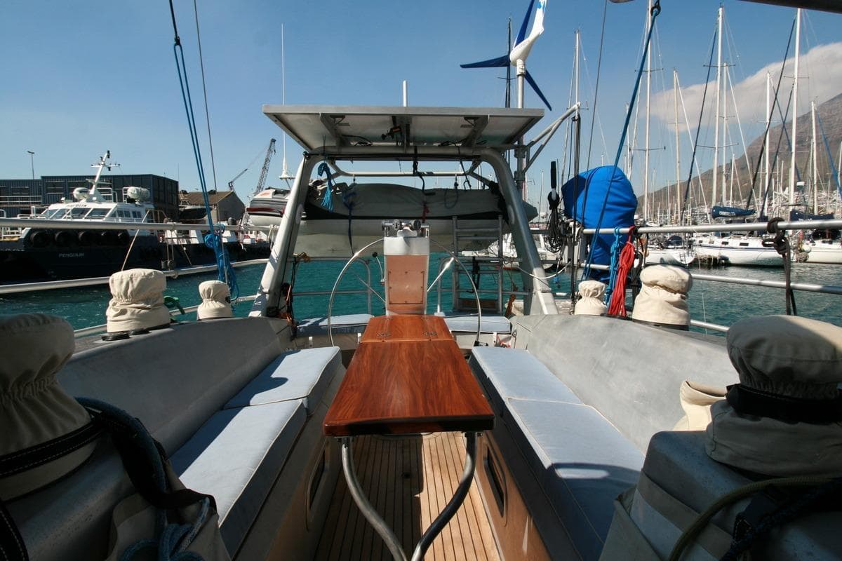 Custom Southwell 51 yacht interior, 2022 model, docked in a marina with clear skies.