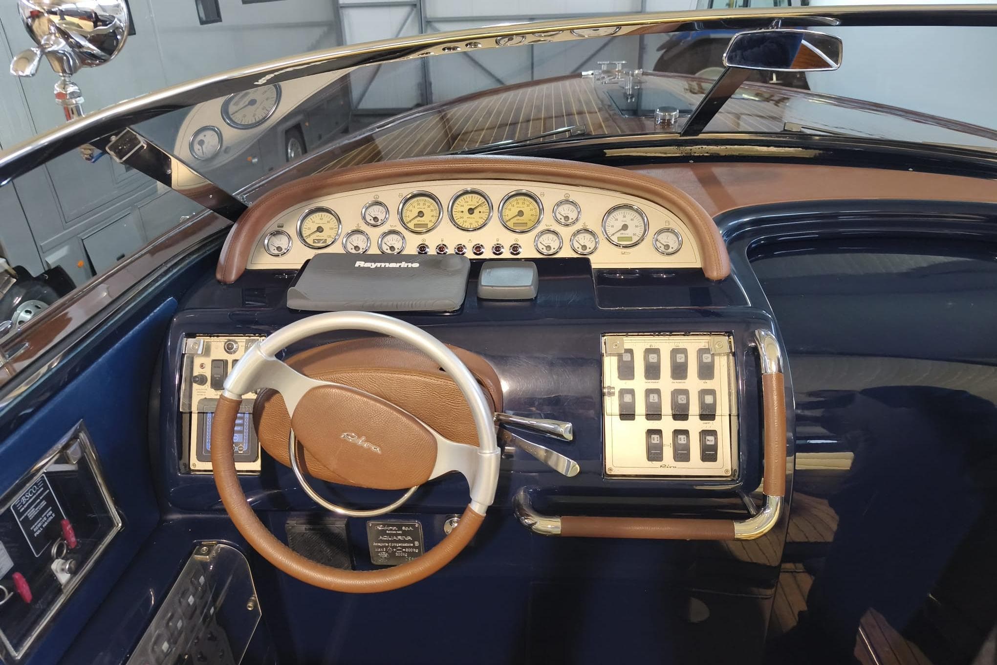 2008 Riva Aquariva Super dashboard with gauges, steering wheel, and control panel.