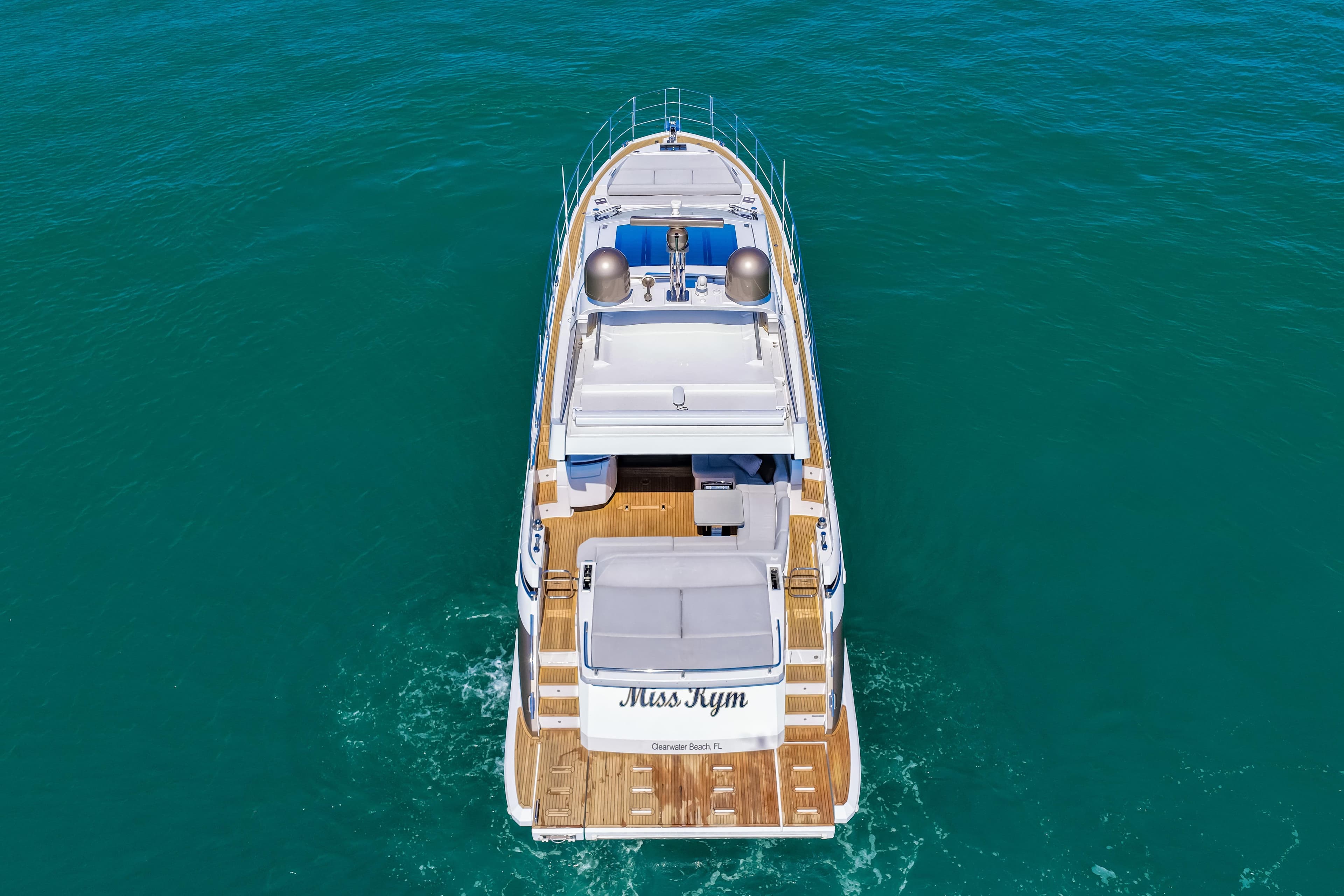 Aerial view of 2020 Azimut S6 yacht cruising on clear blue water.