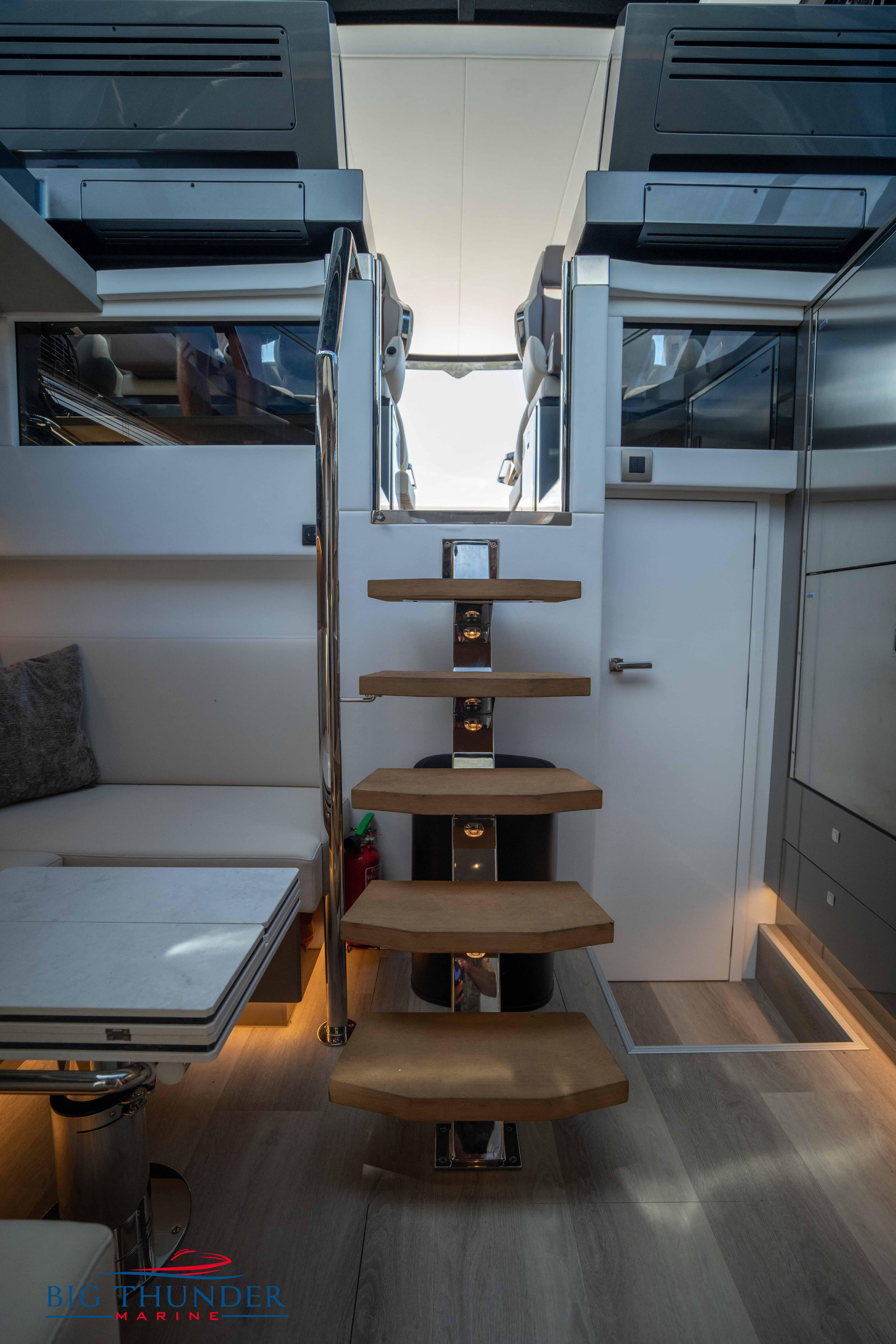 Interior of 2024 Dutch American Iconic DA 50 yacht with modern staircase and seating area.