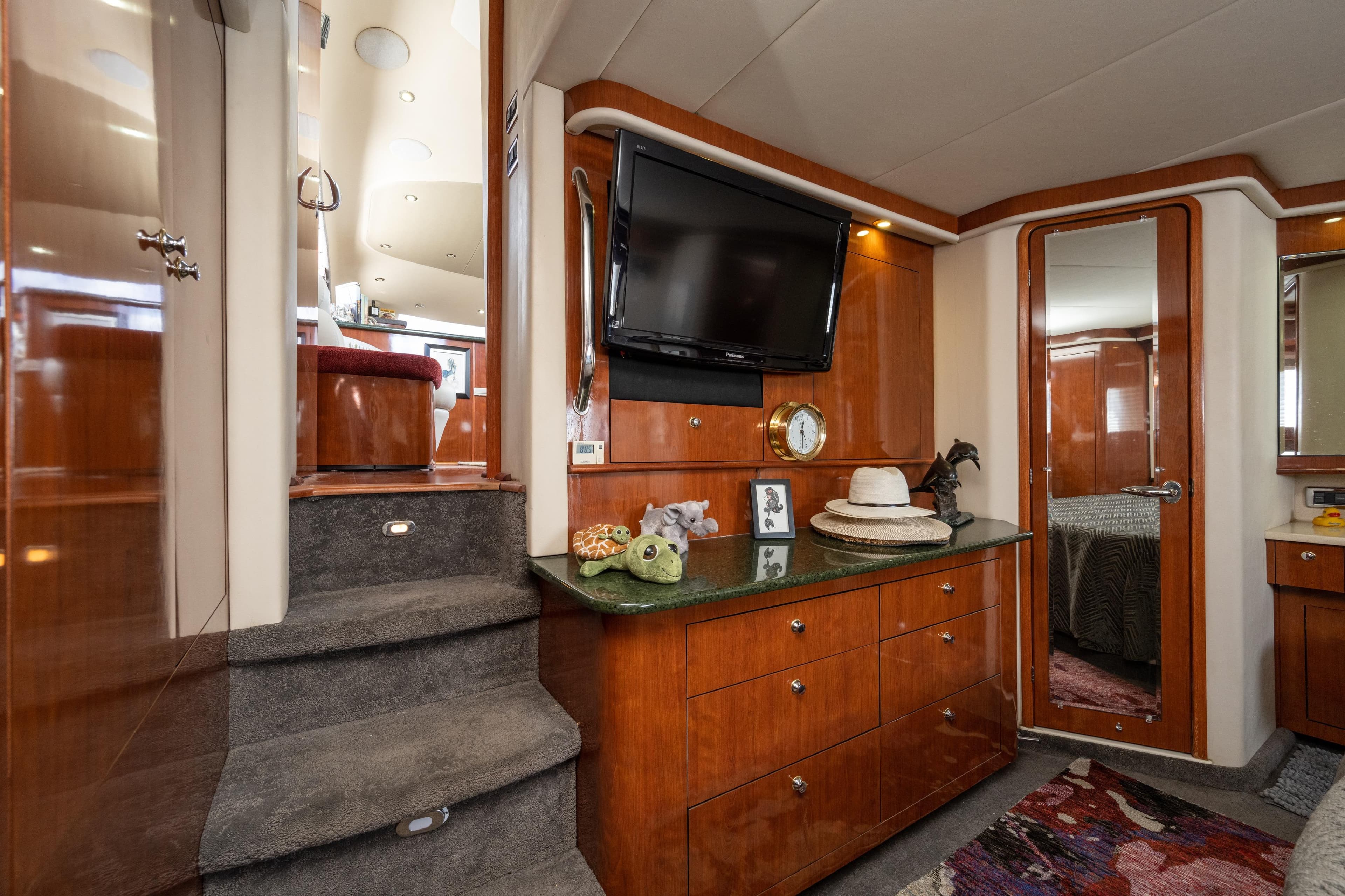 Luxurious interior of 2003 Sea Ray 480 Motor Yacht with elegant wood cabinetry and modern amenities.