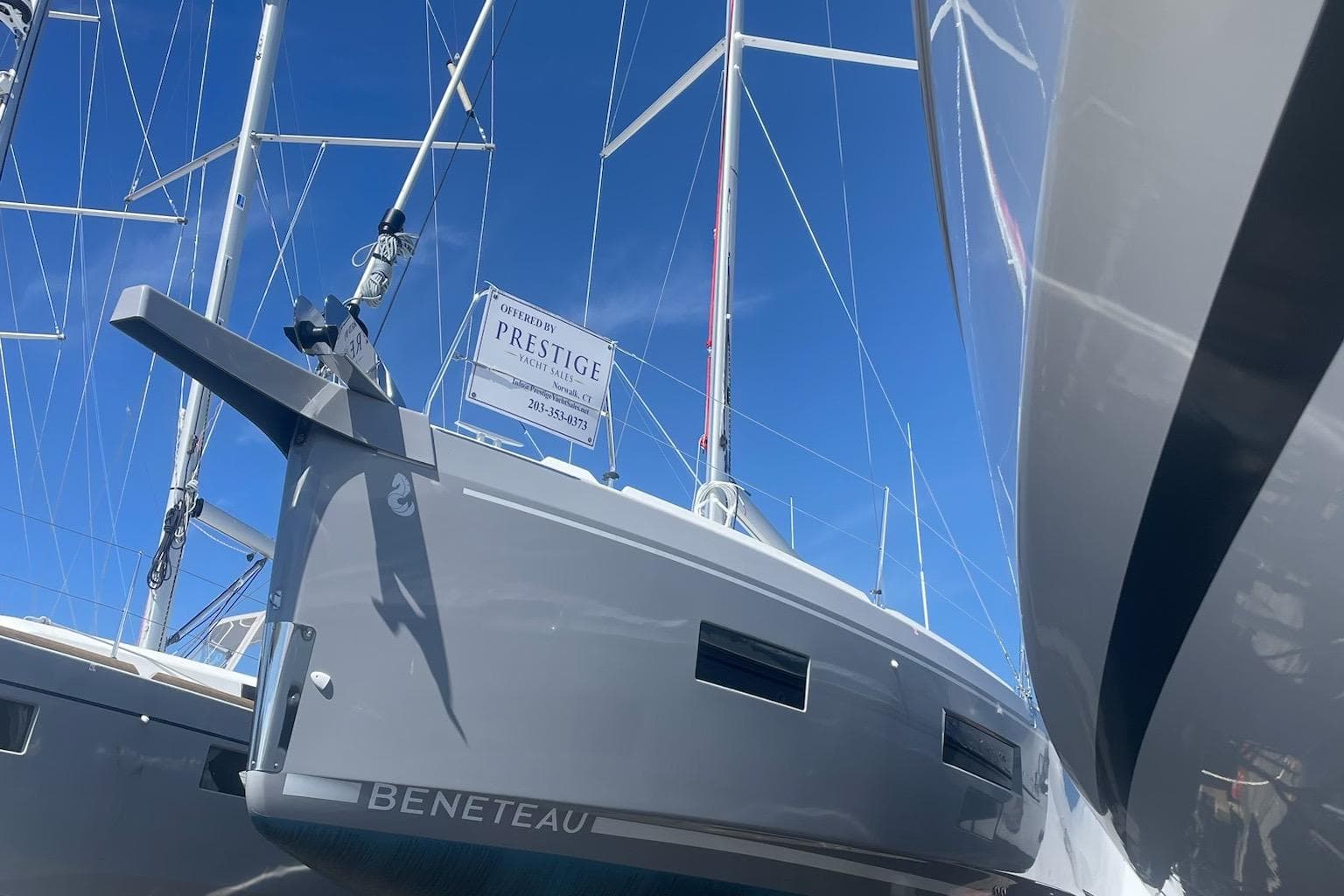 2024 Beneteau Oceanis 34.1 sailboat docked under clear blue sky.
