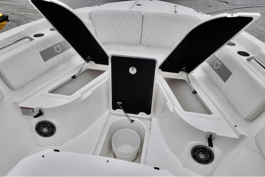 2026 Sea Fox 268 Commander boat interior with open storage compartments and seating.