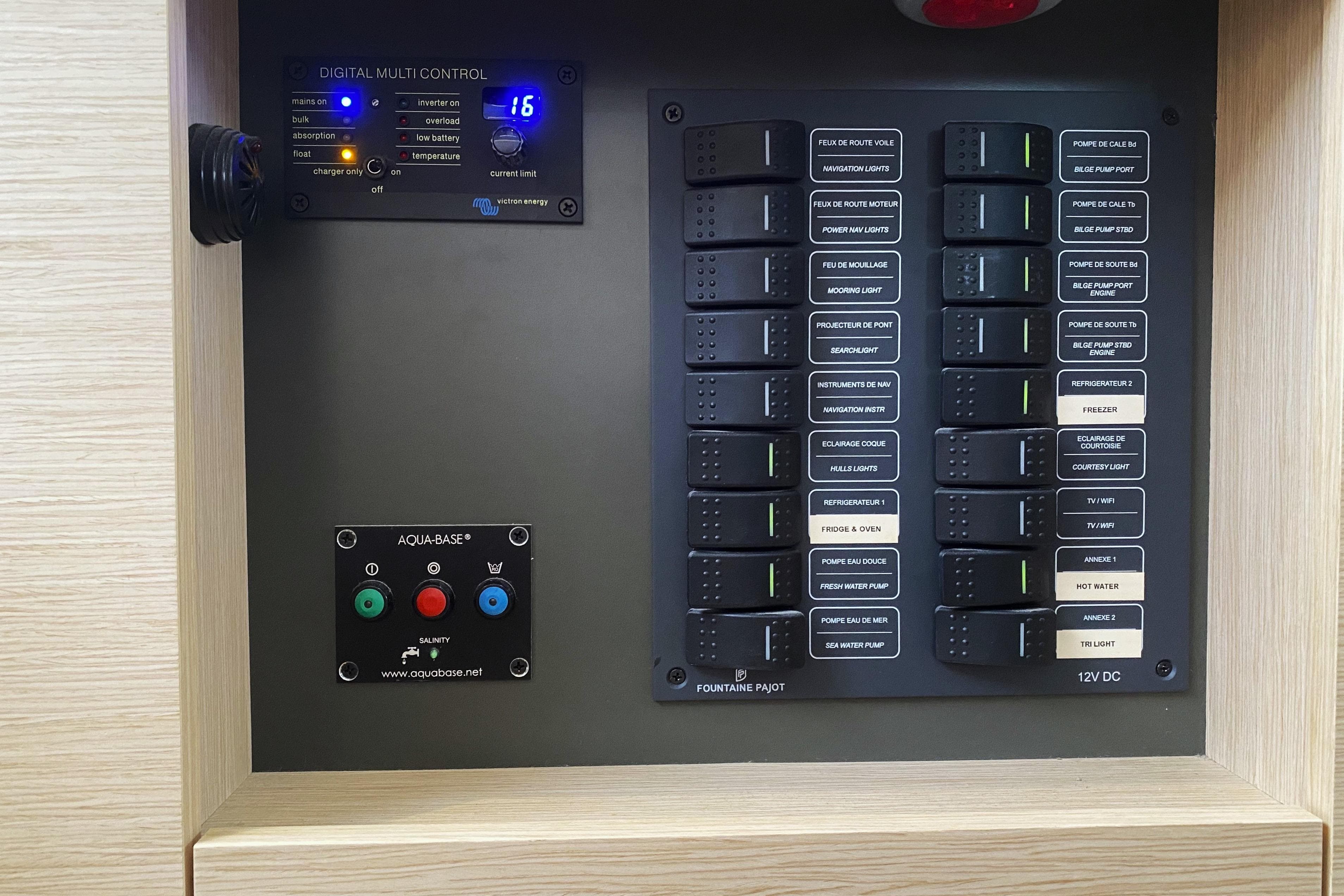Control panel of a 2019 Fountaine Pajot Saona 47 yacht, featuring digital and switch controls.