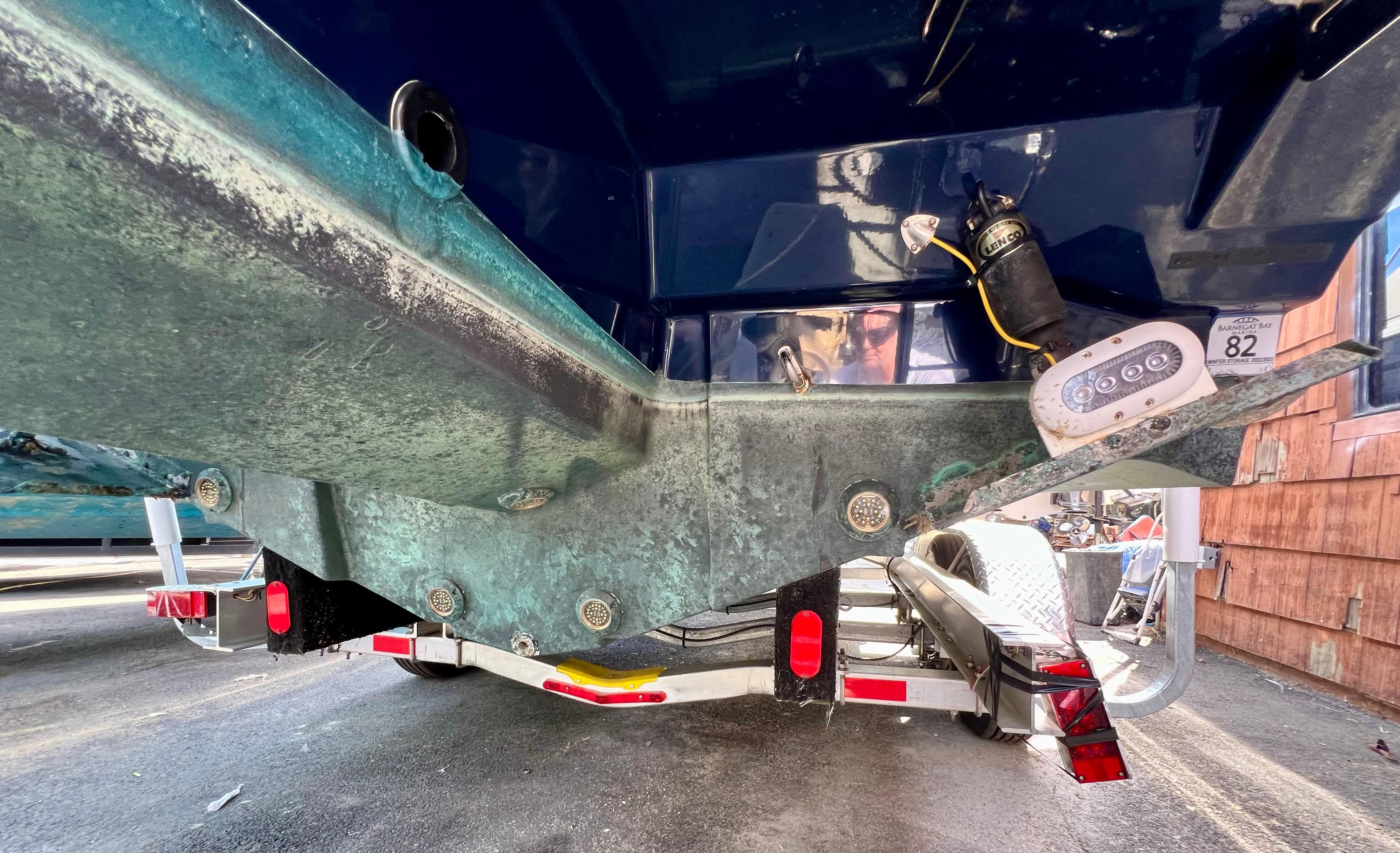 2021 Cutwater C-24 DC boat on trailer, showing hull and trailer details.