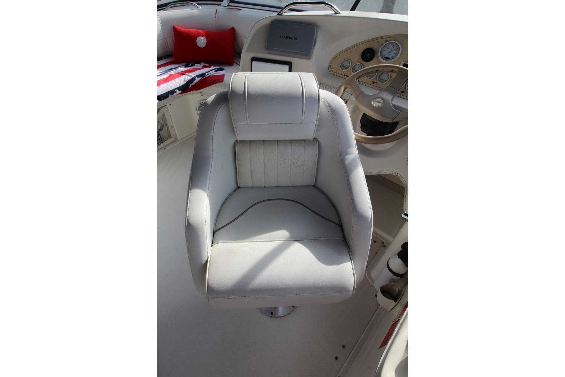 Captain's chair on 1997 Cruisers Yachts 3650 Motoryacht, featuring a sleek helm design.