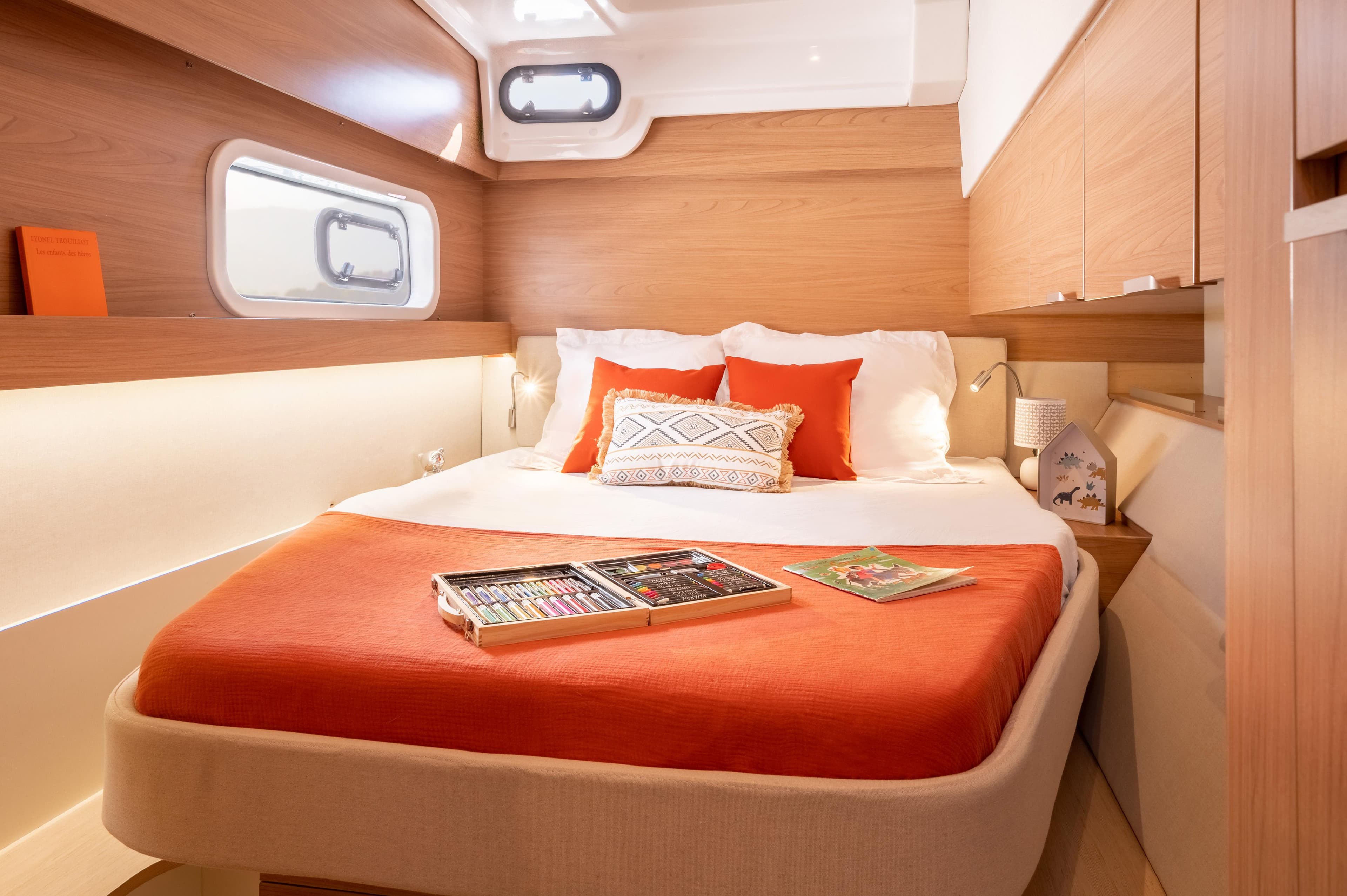 Luxurious cabin interior of 2026 Bali CATSPACE yacht with cozy bed and modern decor.