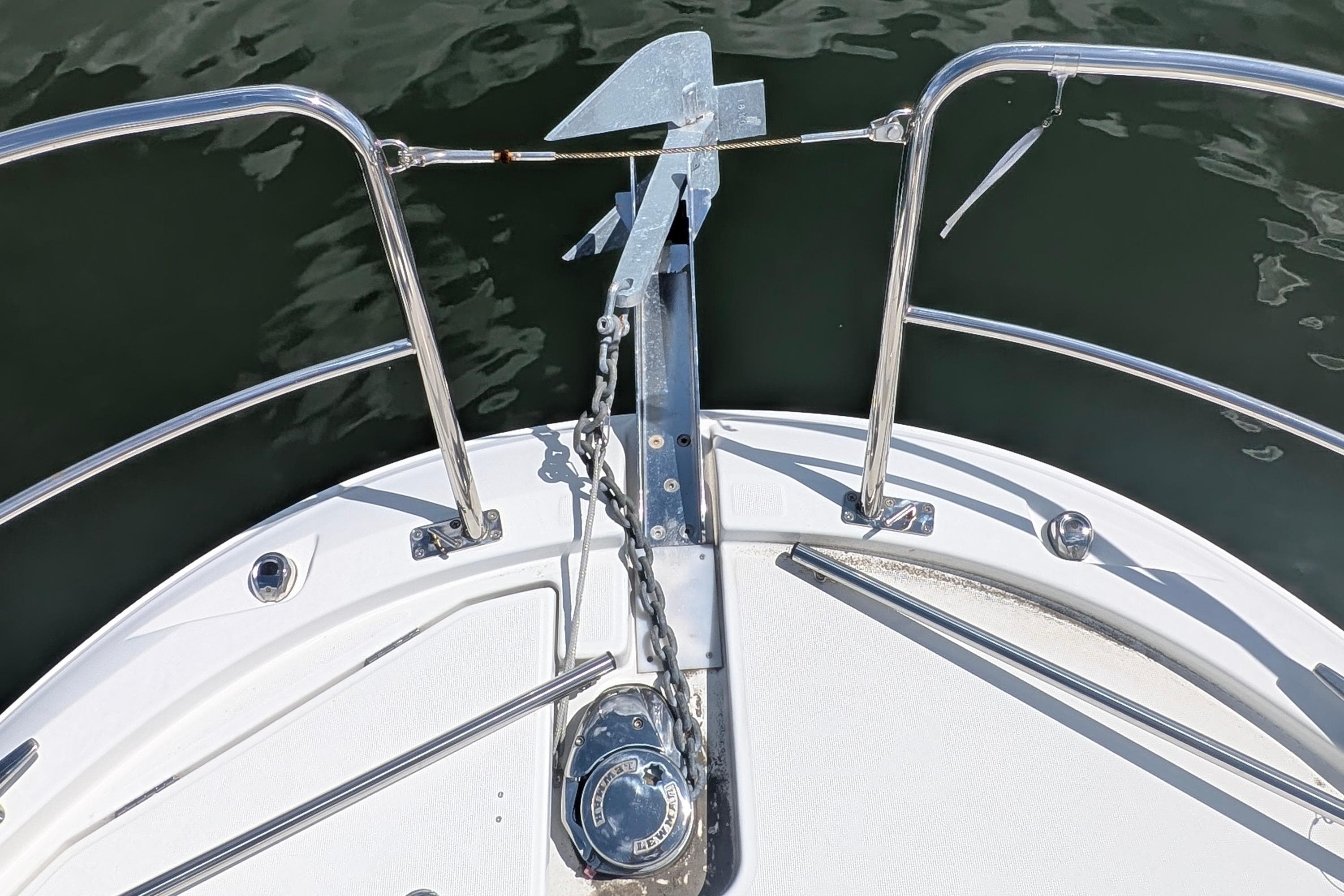 Bow of 2023 Jeanneau NC Weekender 1095 with anchor and railing.