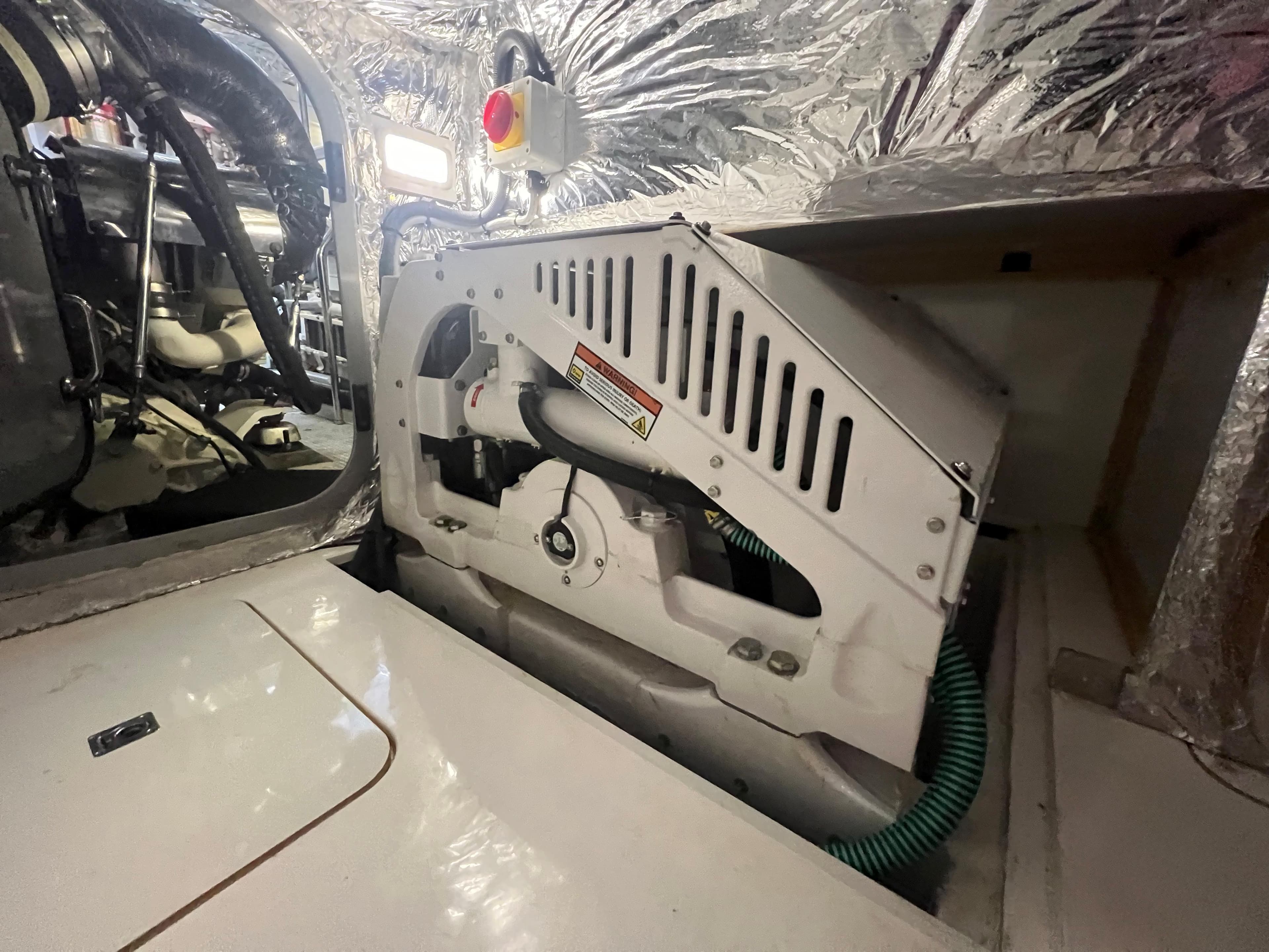 Engine room of 2018 Princess V58 yacht with mechanical components and insulation.