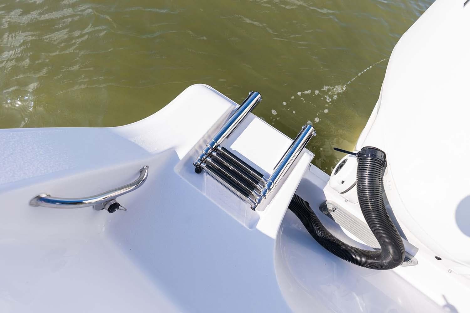 Manufacturer Provided Image: 2024 Sportsman Open 282TE Center Console boat ladder and handle detail.